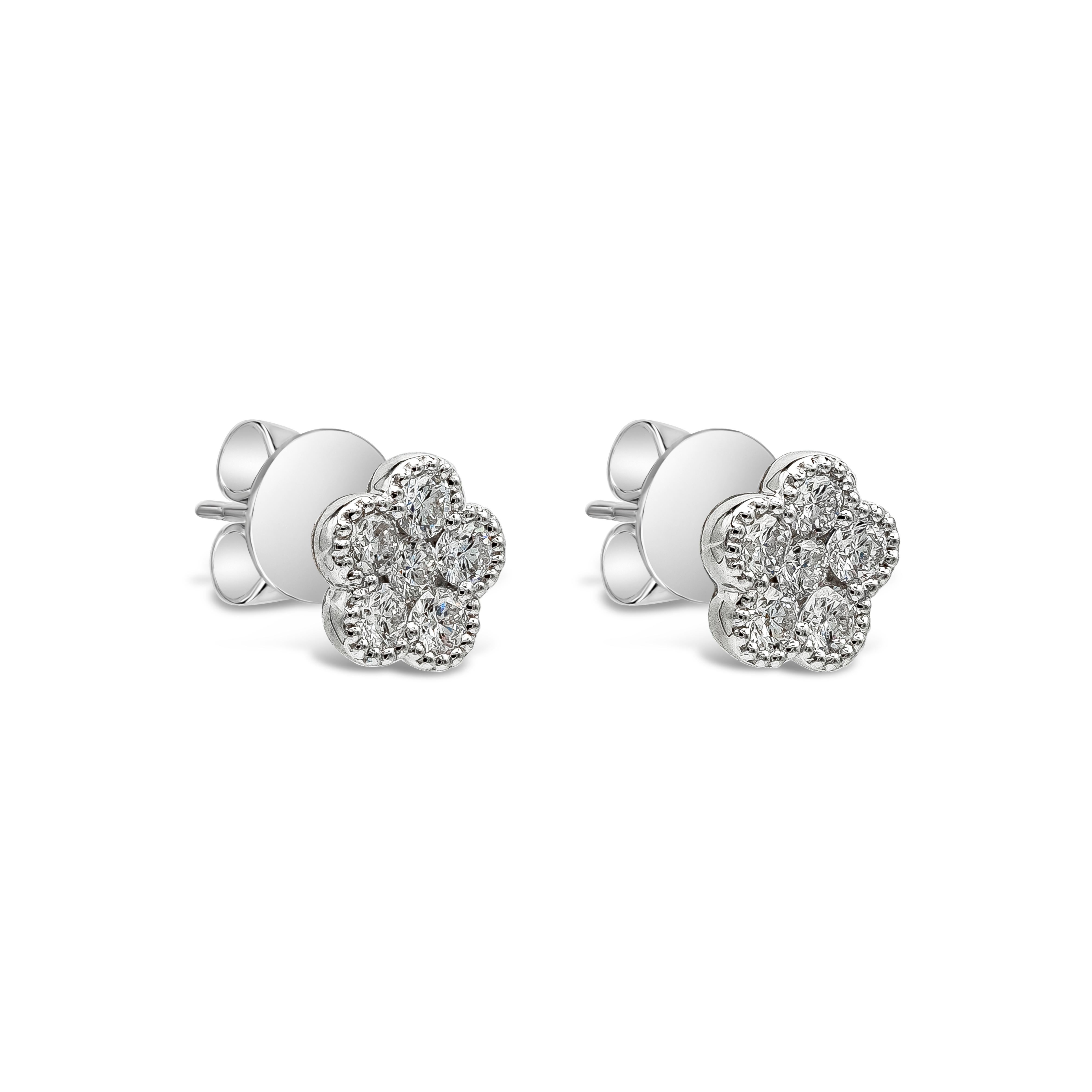 A simple and chic pair of stud earrings showcasing a cluster of round brilliant diamonds, arranged in a floral-motif design made in 18k white gold. Diamonds weigh 0.55 carats total and are approximately F-G color, VS-SI clarity.

Roman Malakov is a