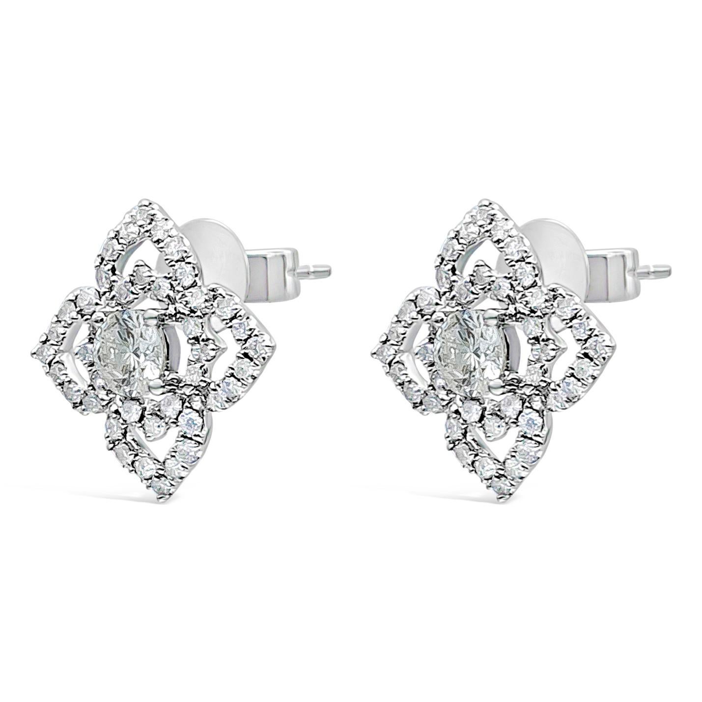 A chic and versatile stud earrings featuring 0.26 carat total brilliant round cut diamond, F color, VS-SI in clarity in the center. Surrounded by 80 pieces of sparkling round cut diamond in an intricate open-heart floral motif design weighing 0.30