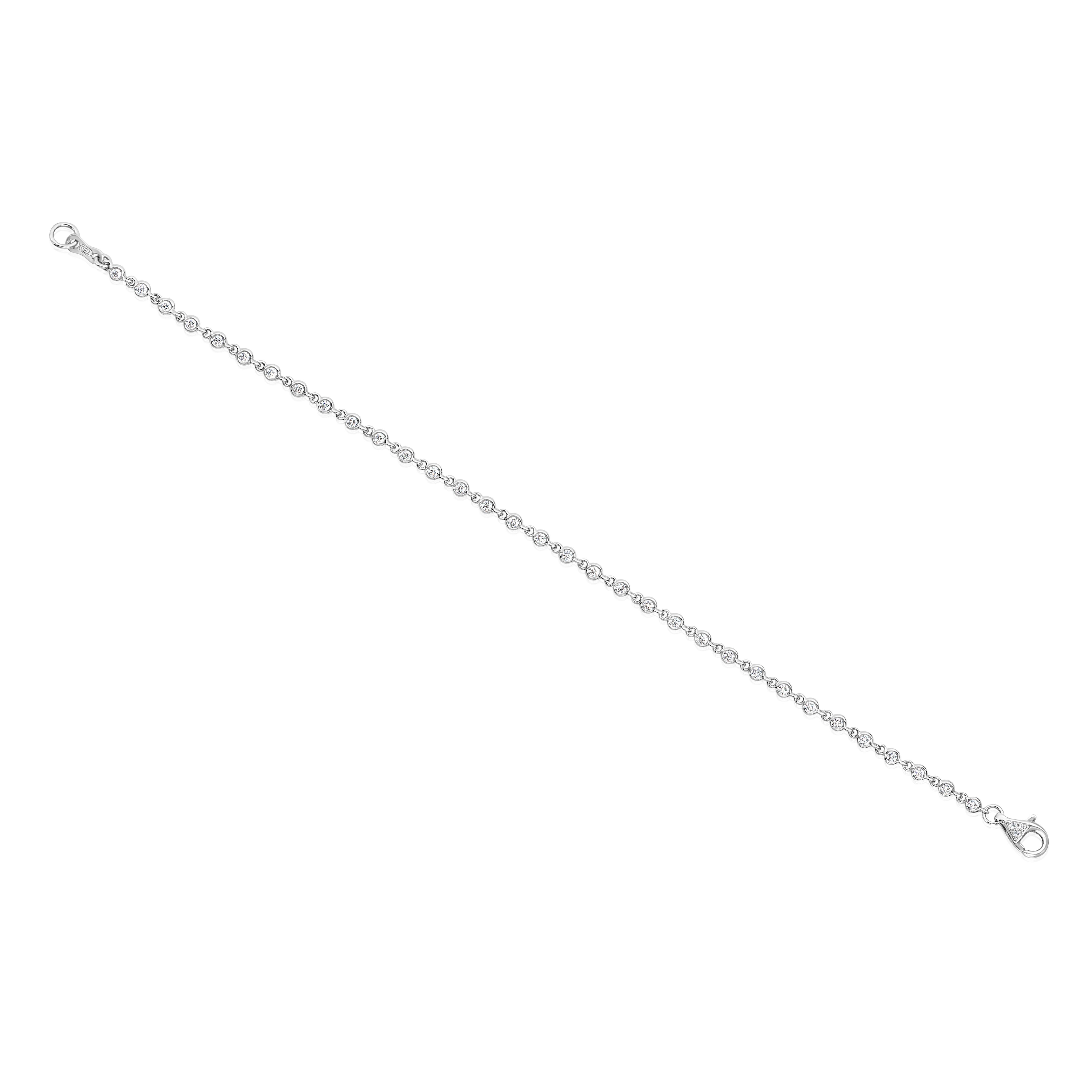 A stylish fashion bracelet, featuring round brilliant cut diamonds weighing 0.58 carat total, bezel-set in connecting links. Lobster clasp is accented by a cluster of round cut melee diamonds. Finely made with 18K white gold, 7 inches in length.