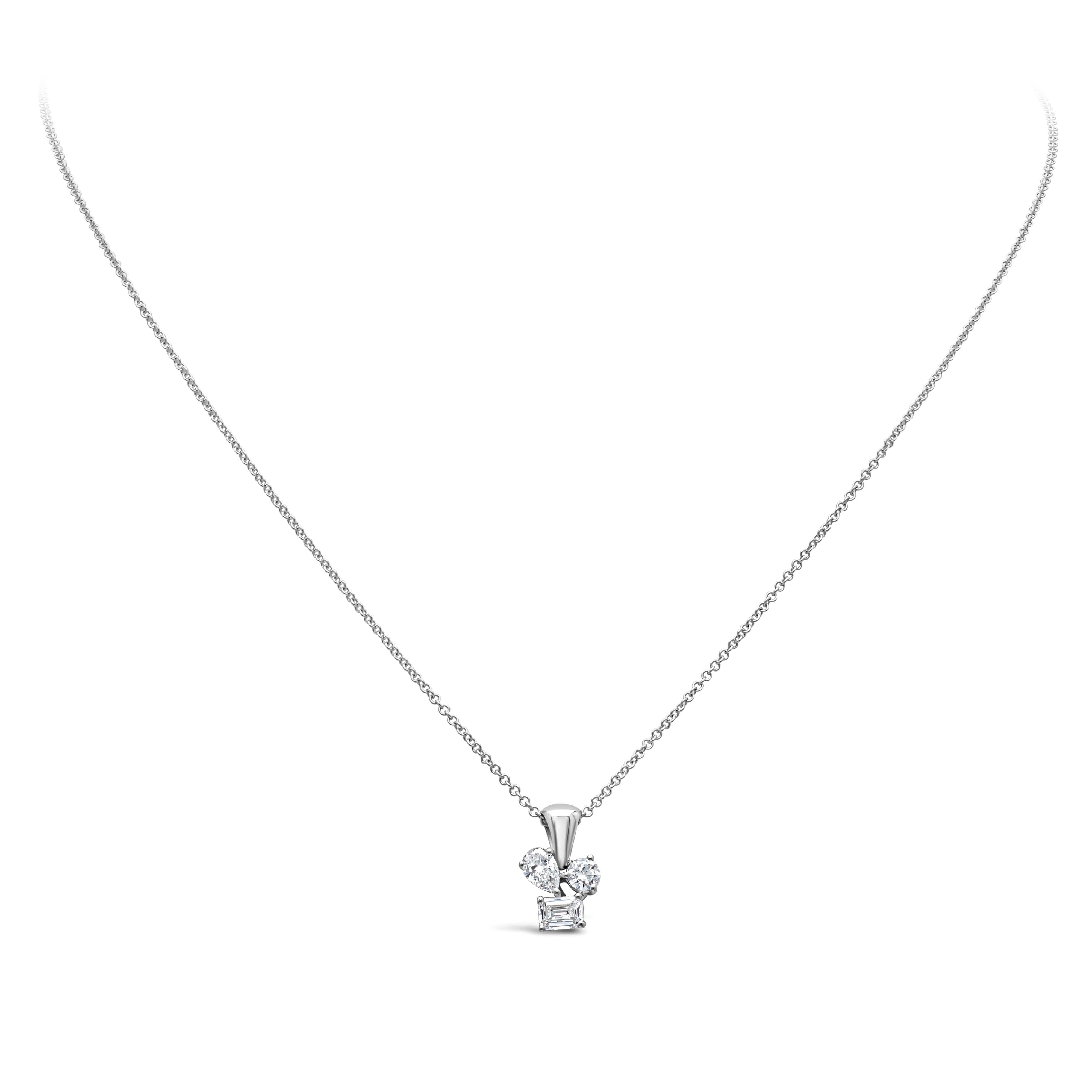A simple pendant necklace showcasing pear, round and emerald mixed-cut diamonds, set in a 18K White Gold. Diamonds weigh 0.60 carats total, F color and SI in clarity. Suspended on a 18 inch 14K White Gold chain. Perfect for your everyday use.