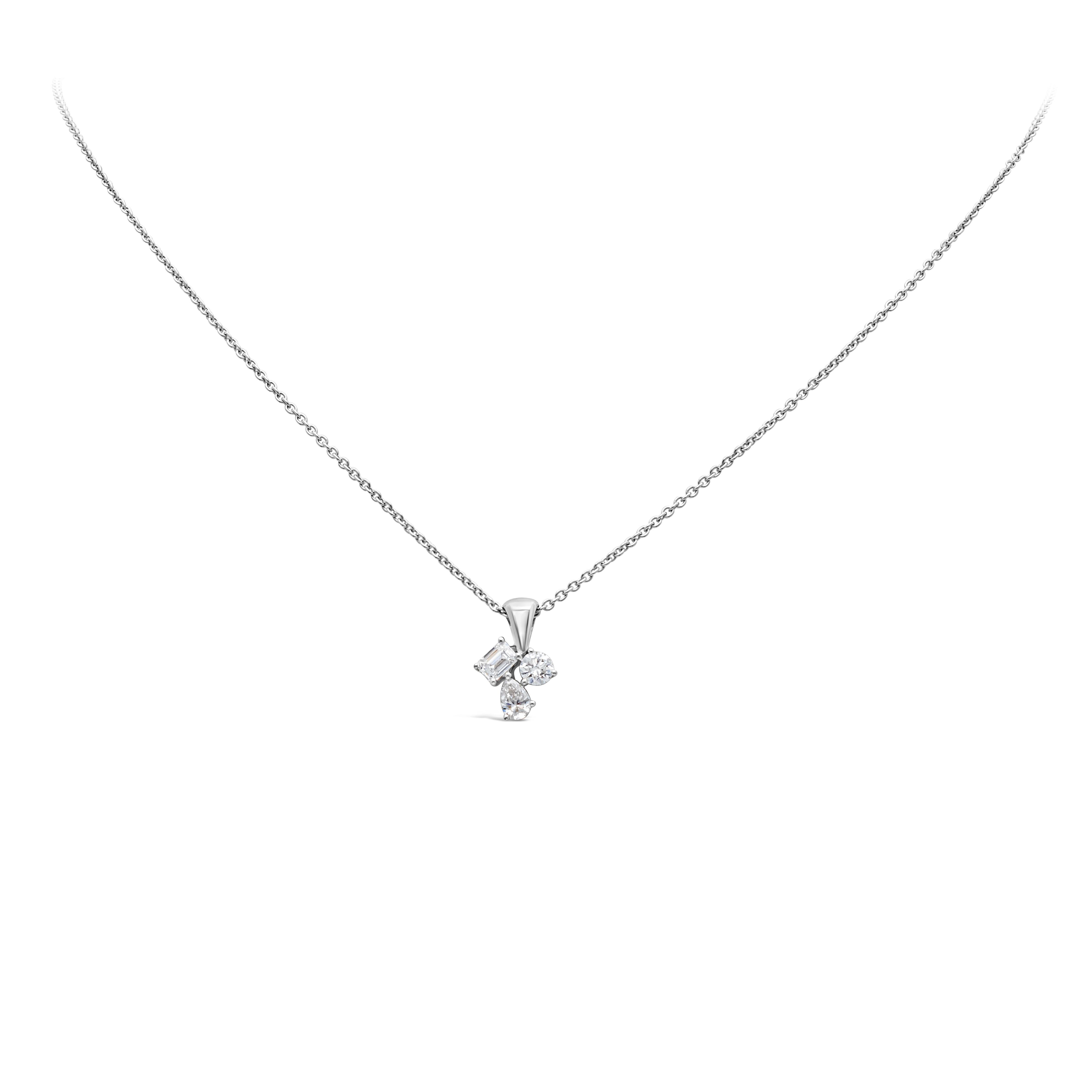 A simple pendant necklace showcasing pear, round and emerald mixed-cut diamonds, set in a 18K White Gold. Diamonds weigh 0.60 carats total, F color and SI in clarity. Suspended on a 18 inches 14K White Gold chain. Perfect for your everyday