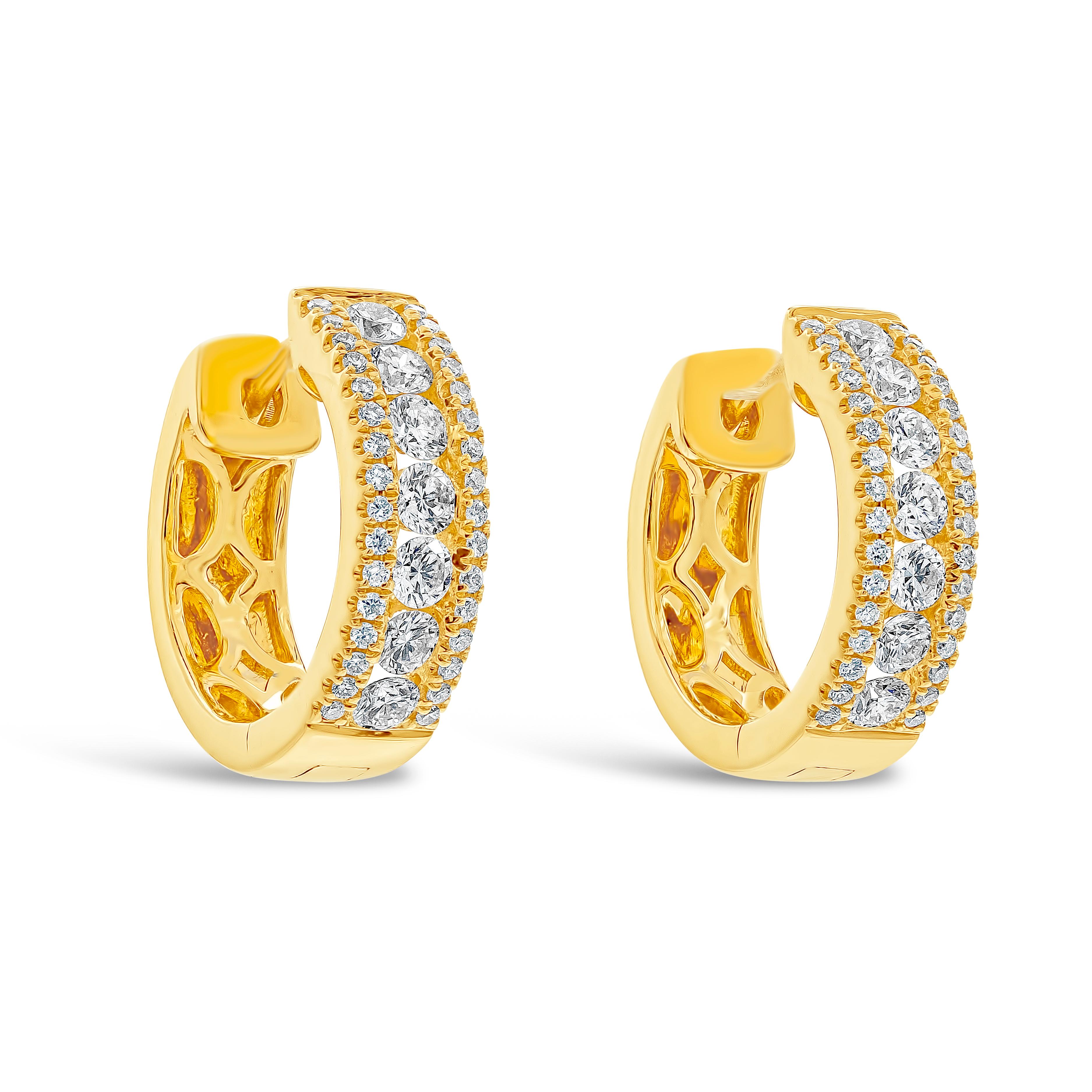 A simple pair of hoop earrings showcasing a row of round brilliant diamonds, set in-between round melee diamonds. Made in 18k yellow gold. Diamonds weigh 0.61 carats total. 

Roman Malakov is a custom house, specializing in creating anything you can