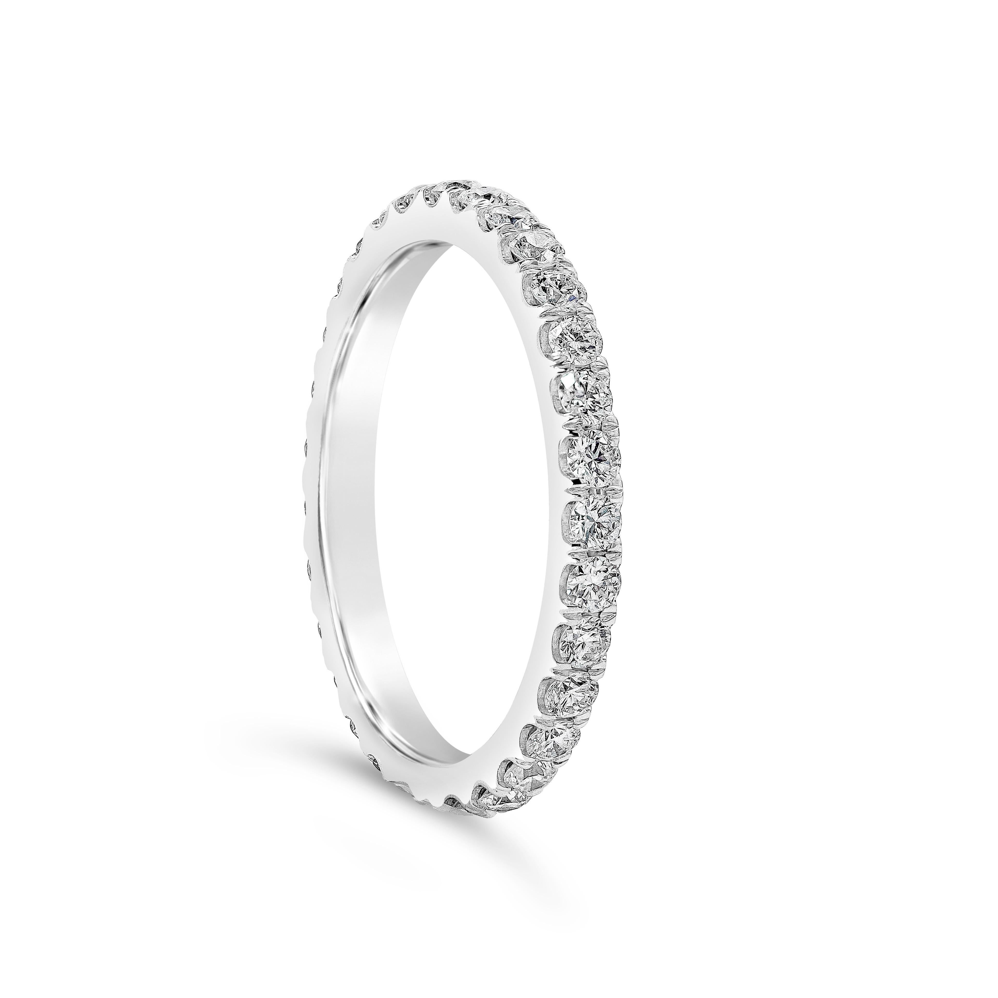 A classic eternity wedding band style showcasing a row of round brilliant diamonds weighing 0.65 carats total, G Color and VS in Clarity. Pave-set, Made with Platinum. Size 6.5 US

Roman Malakov is a custom house, specializing in creating anything