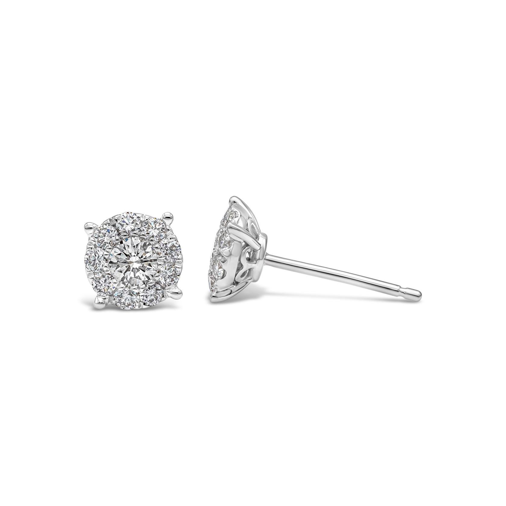 A budget-friendly style stud earrings showcasing a cluster of round brilliant diamonds set in an 18k white gold setting. The earrings exude the look of a  one carat each diamond stud earrings. Diamonds weigh 0.66 carats total.

Style available in