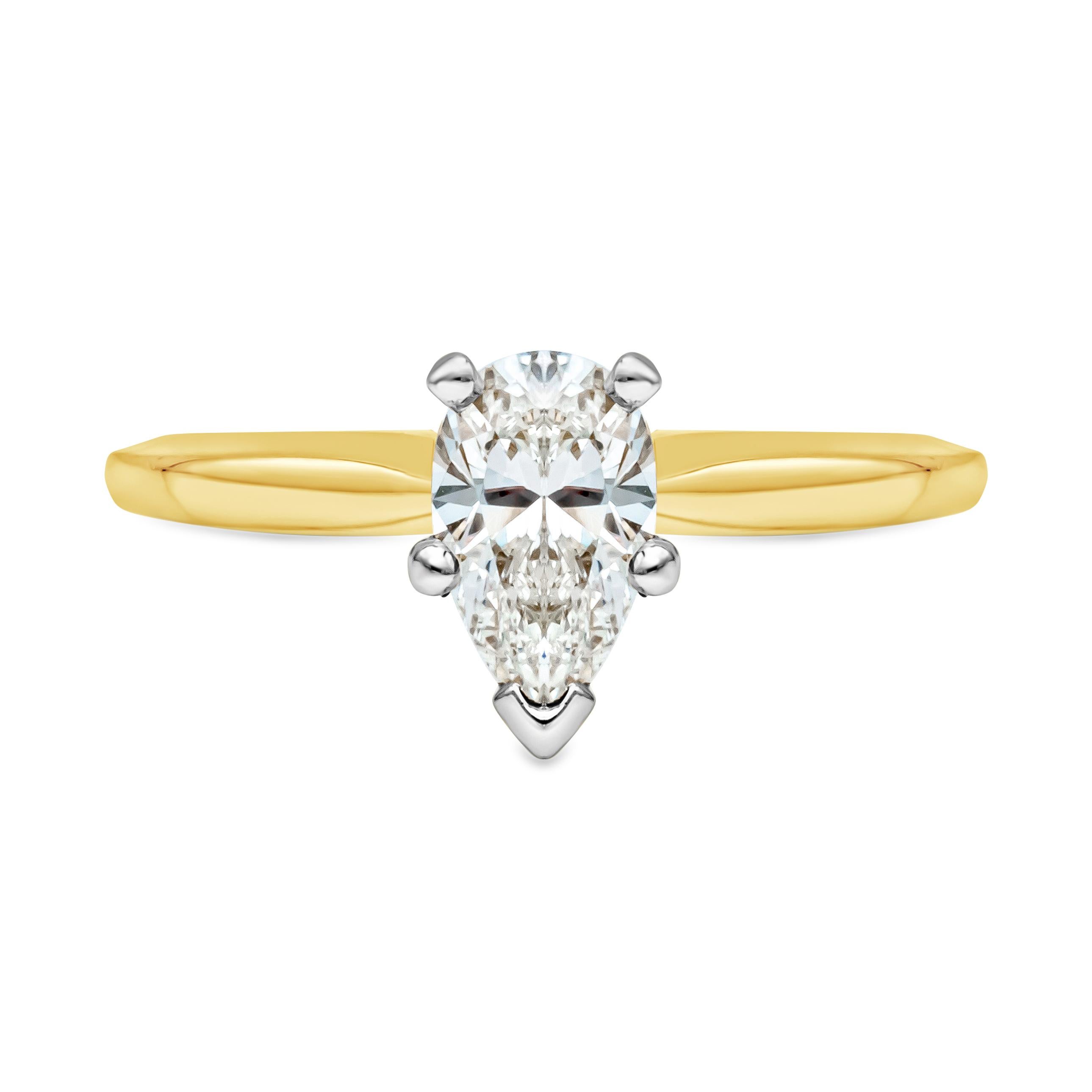 A classic and simple engagement ring design showcasing a single 0.71 carat pear shape diamond center, set in a five prong basket setting. Finished with a chic knife-edge design in 14K yellow gold. Size 5.75 US resizable upon request.

Roman Malakov