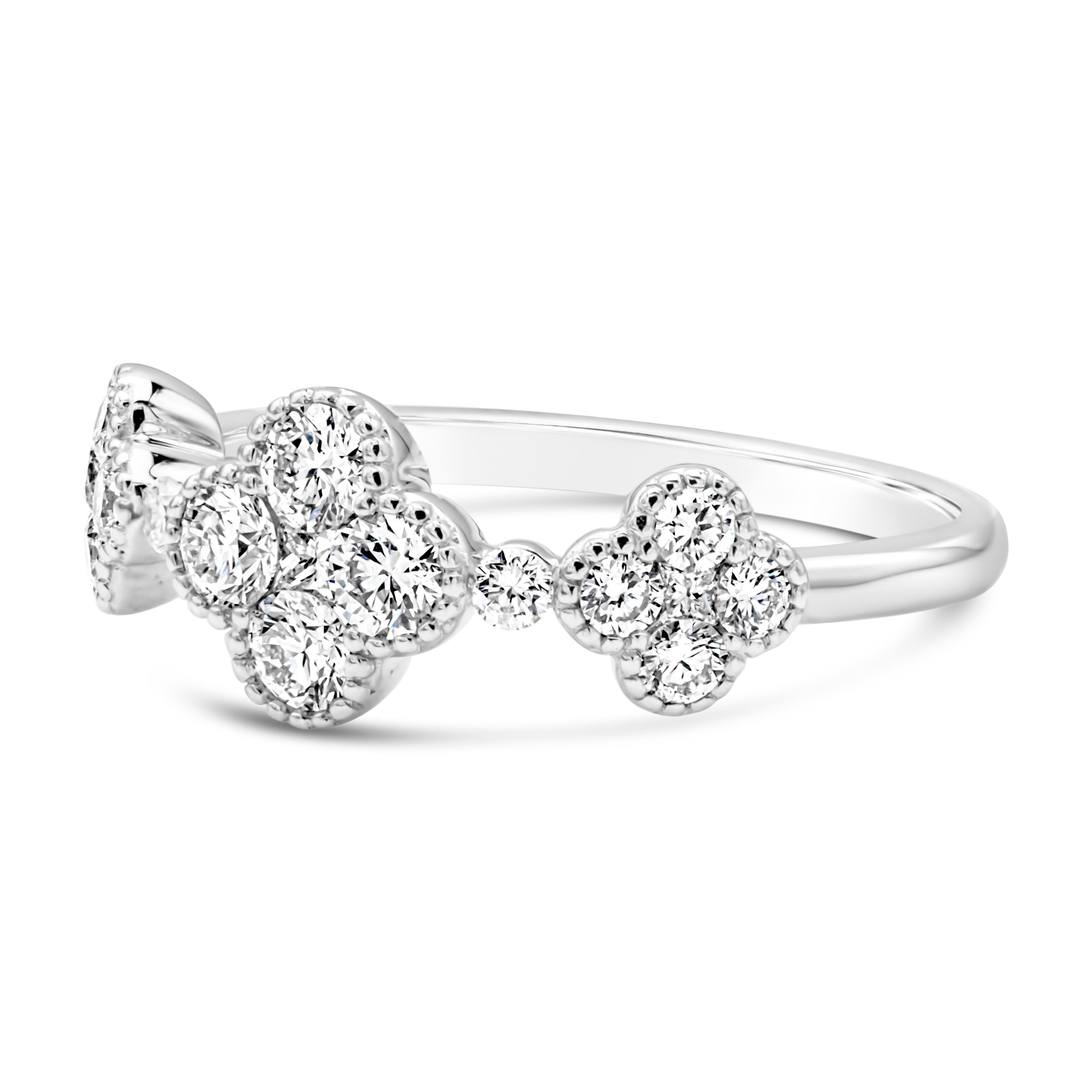 This unique and fashionable ring showcases three beautiful clover evenly spaced with brilliant round diamond in an accented 18k white gold mounting. Each clover is set with 5 brilliant round shape diamonds and set in a shared prong basket setting.