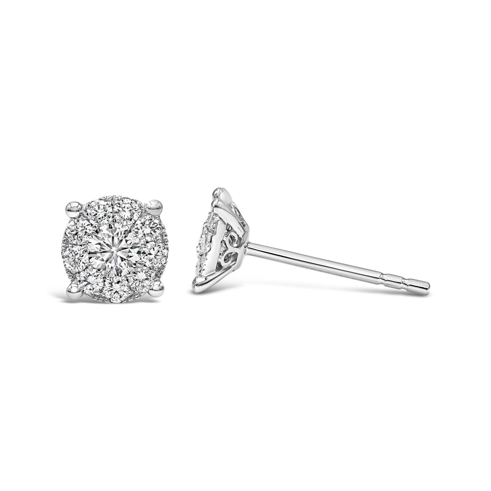 A classic pair of stud earrings showcasing a cluster of round brilliant diamonds weighing 0.76 carats total, G Color and VS in Clarity. The earrings exude the look of a one carat each diamond stud earrings. Made with 18K White Gold.

Style available