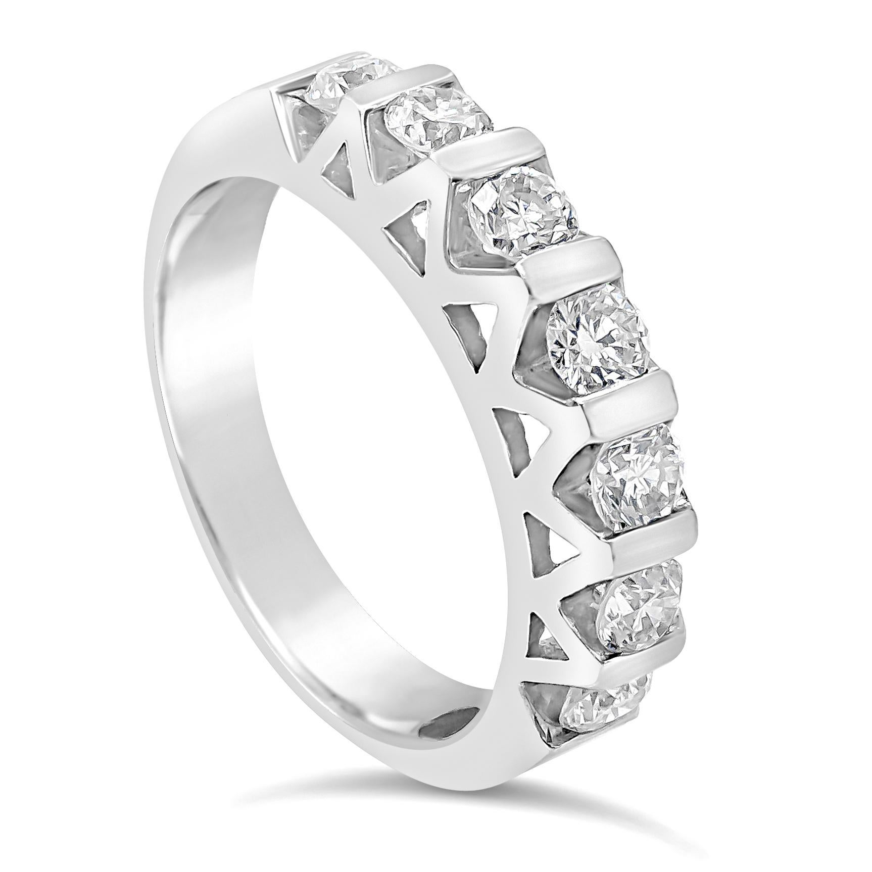 A unique and chic wedding band showcasing seven round brilliant diamonds, Diamonds weigh 0.80 carats total. Each bar is connected to form a creative geometrical shape on the ring. Made with 14K White Gold. Size 7 US.

Roman Malakov is a custom