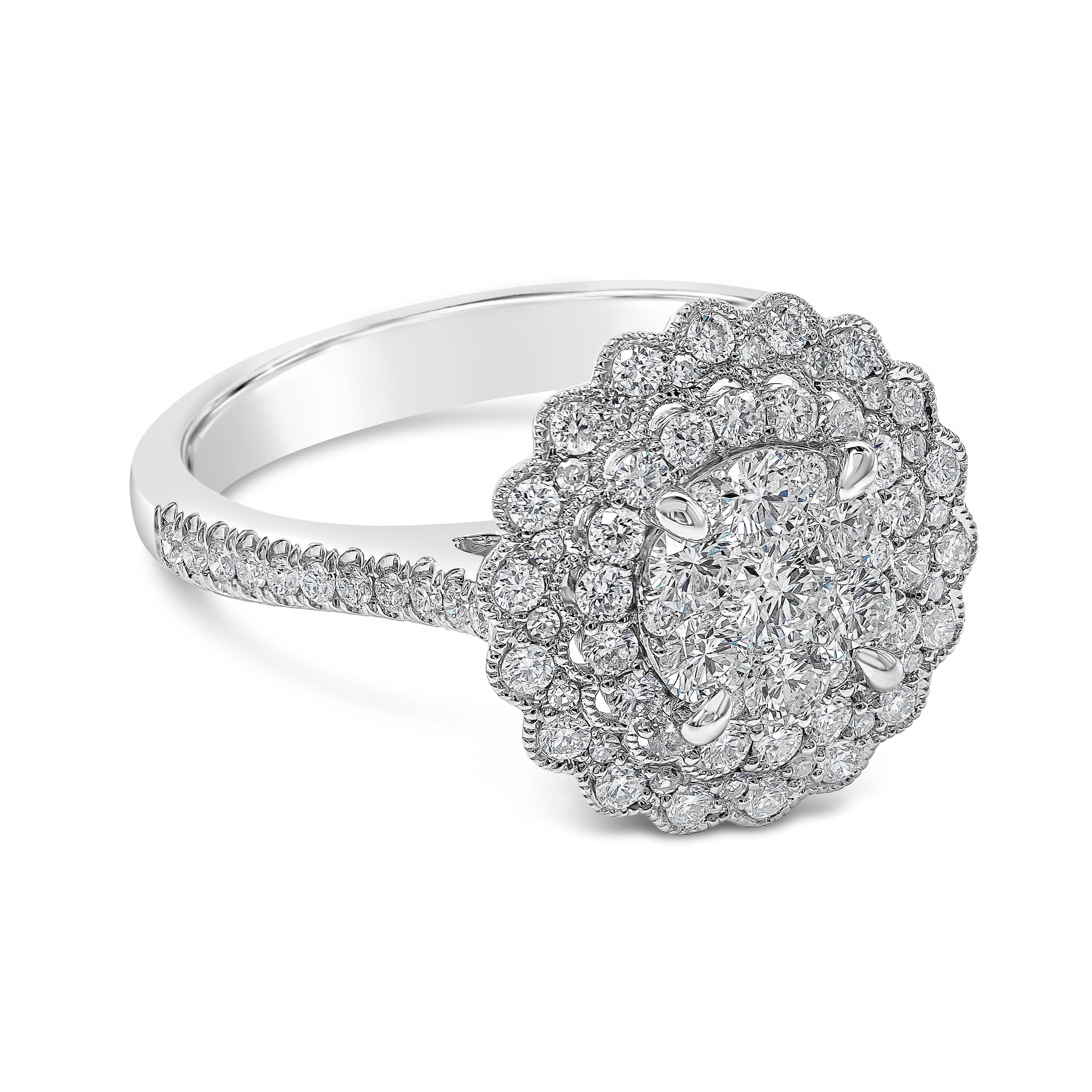 A charming engagement ring style showcasing a round brilliant cut diamond in the center surrounded by two rows of round brilliant diamonds set in a flower-motif design. Finished with milgrain edges. Accented with more diamond set half-way down the