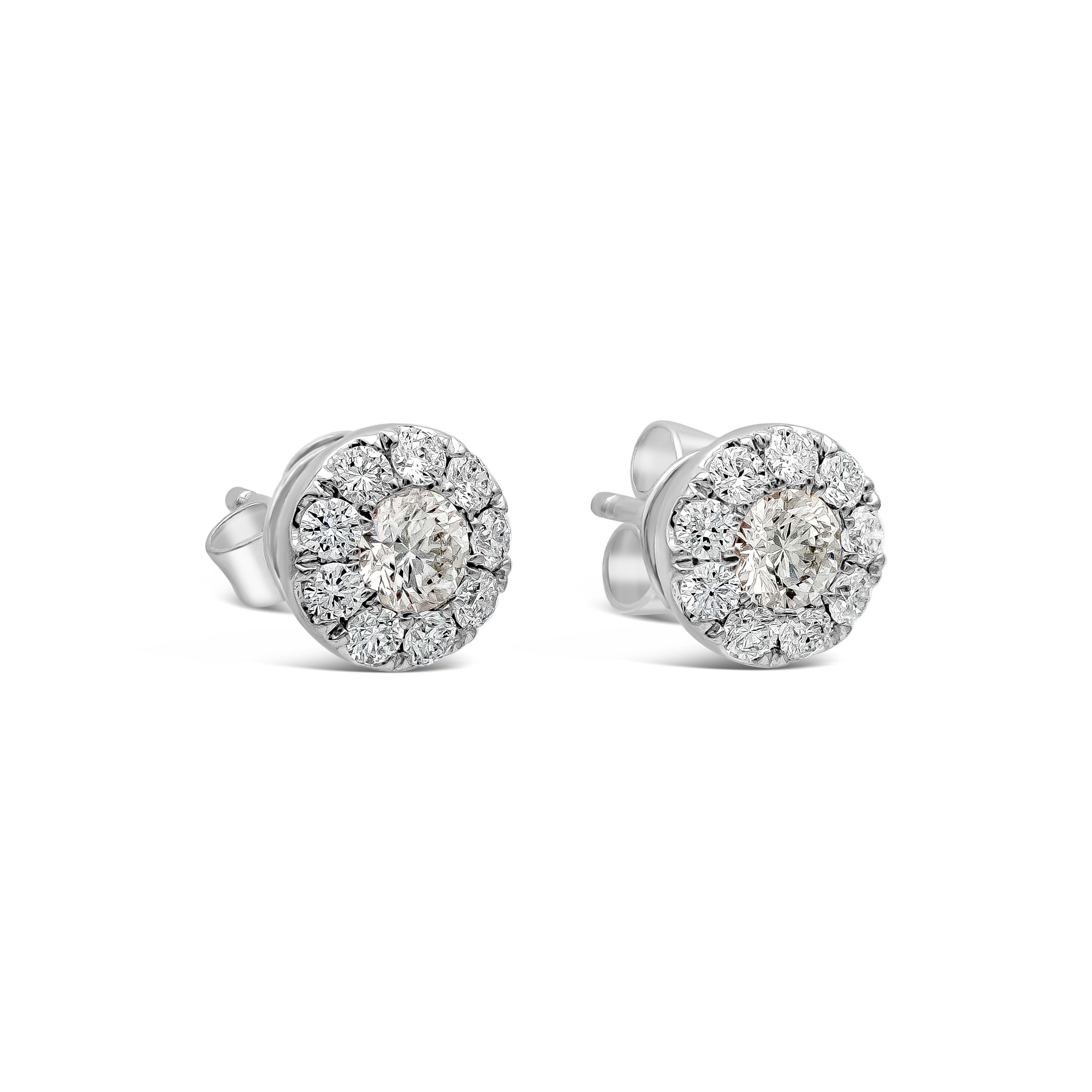 A classic pair of stud earrings showcasing a cluster of round brilliant diamonds set in an 18k white gold mounting. Diamonds weigh 0.85 carats total and are approximately G color, SI clarity. 

Style available in different price ranges. Prices are