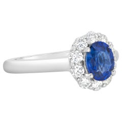 Roman Malakov Anillo de compromiso con halo de diamantes y zafiro talla oval de 0,94 quilates