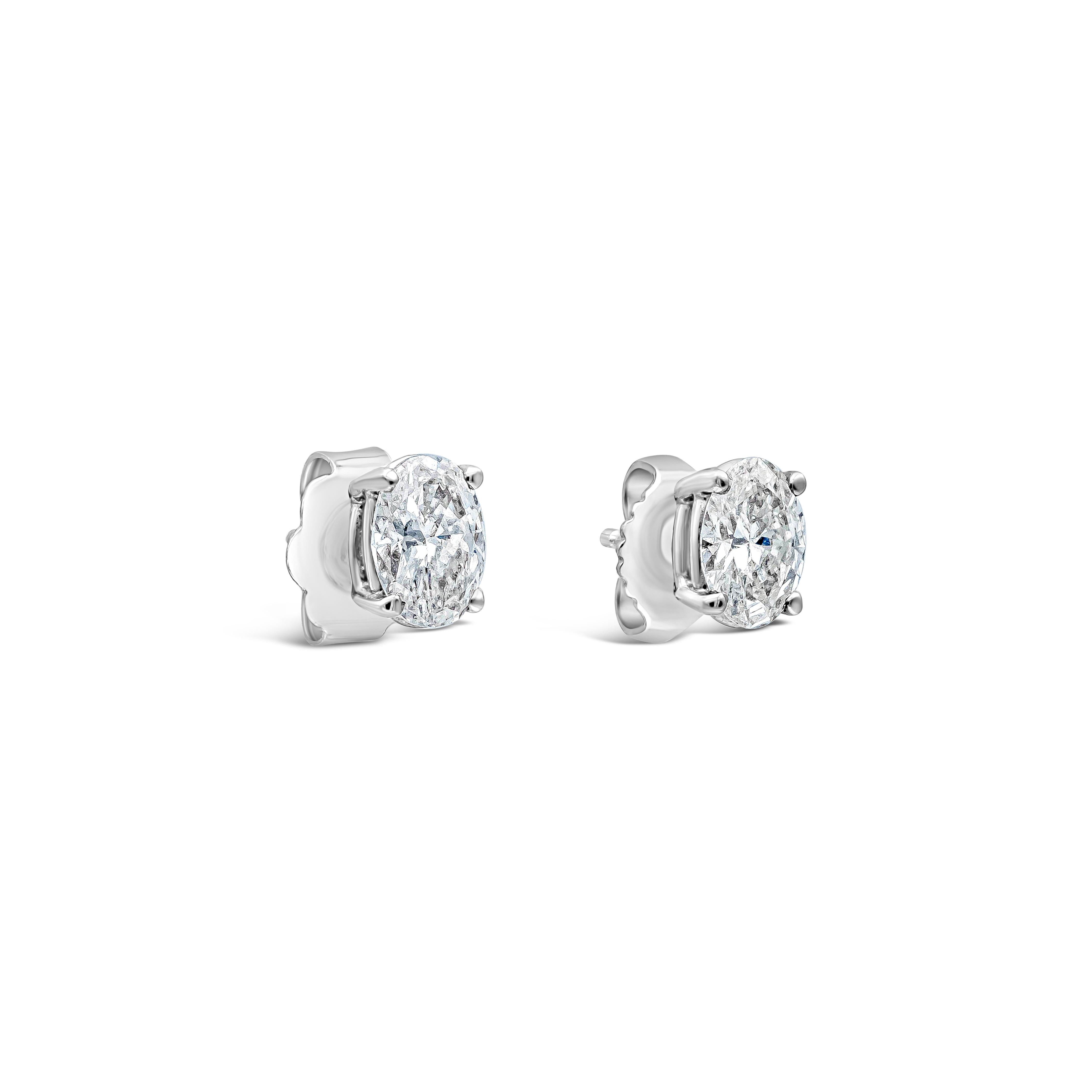 Stud earrings are forever elegant and timeless. Features a 0.95 carat total brilliant oval cut diamond set in a 4 prong 14 karat white gold basket. Approximately G-H color, VS clarity.

Style available in different price ranges. Prices are based on
