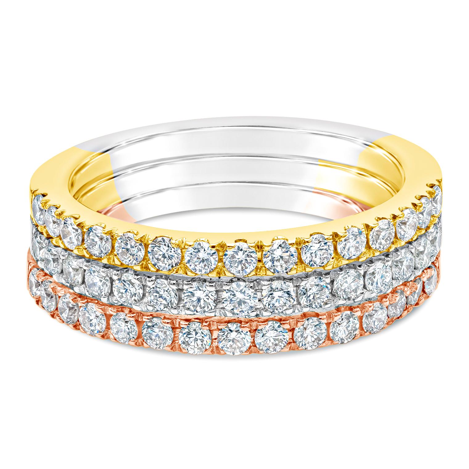 A fashionable wedding band, showcasing three stacked rings set half-way with round brilliant cut diamonds weighing 1.01 carats total with F color and VS clarity. Set on 14K tri-color yellow, white, and rose gold. Size 7 US.

Roman Malakov is a