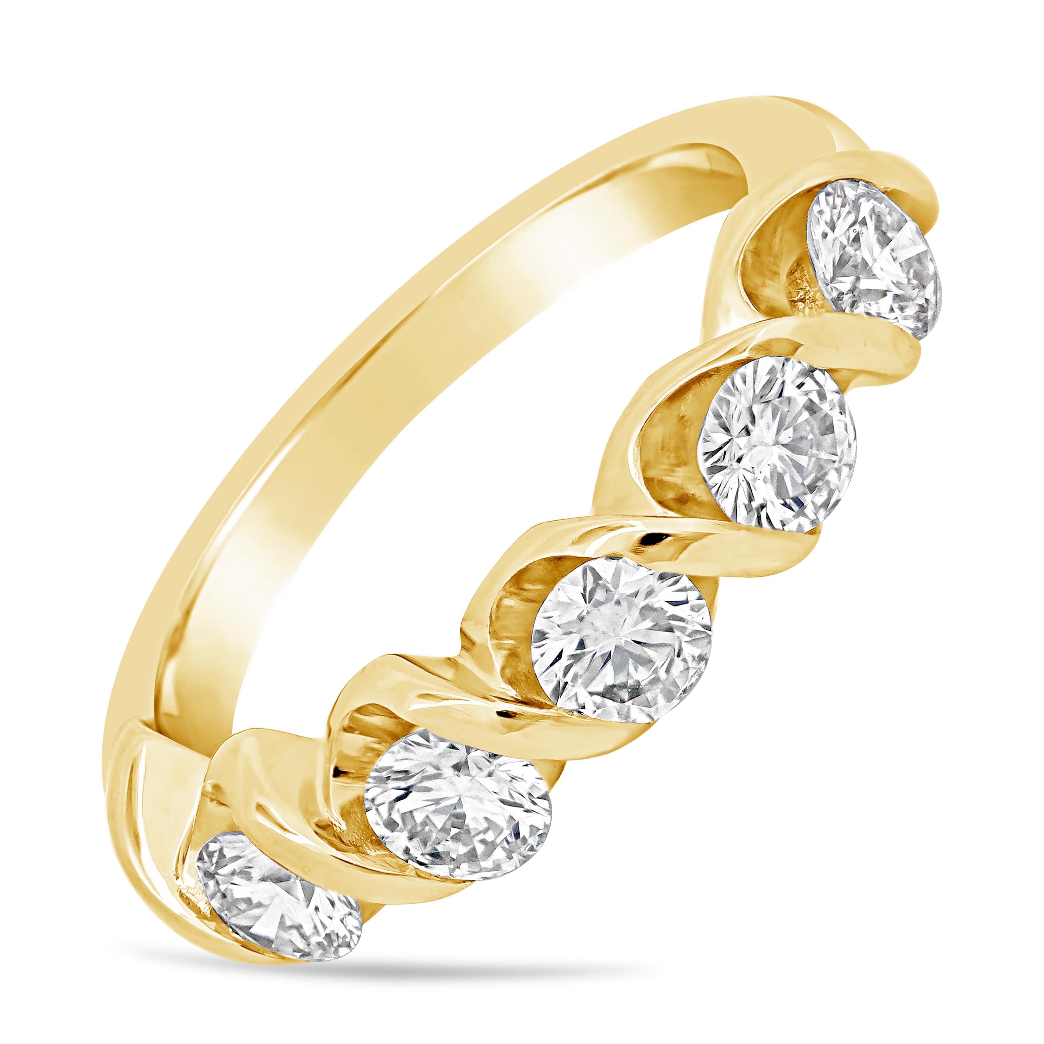 Uniquely-designed and expertly-crafted wedding band set with 5 round brilliant diamonds weighing 1.01 carats total, bar set in a twisting design composition. Made with 18K Yellow Gold, Size 6.75 US resizable upon request.

Roman Malakov is a custom