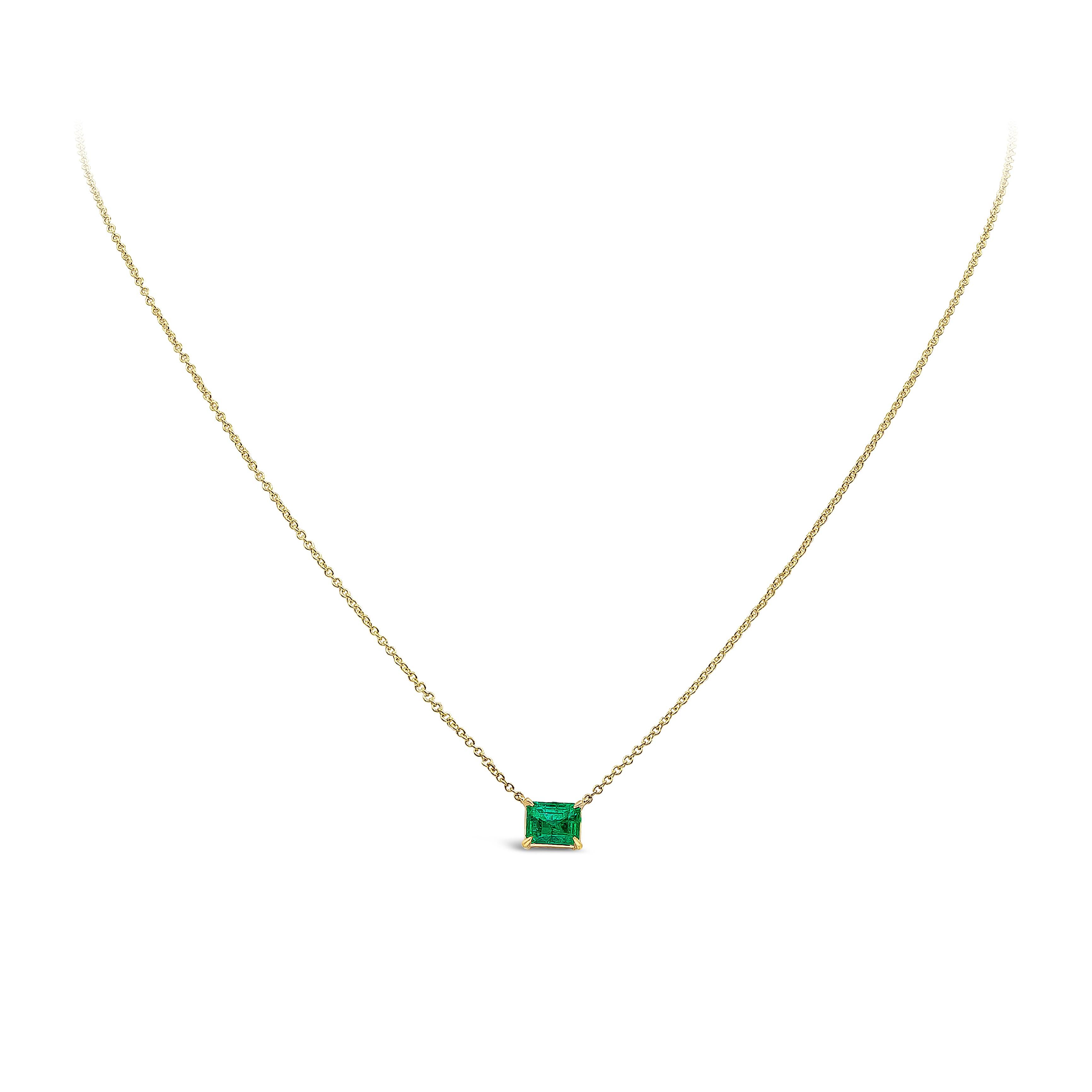  A classic solitaire pendant showcasing a 1.04 carat emerald cut green emerald, set in a four-pong basket made in yellow gold. Suspended on a 16 inch yellow gold chain (length of chain can be changed upon request). 

Style available in different