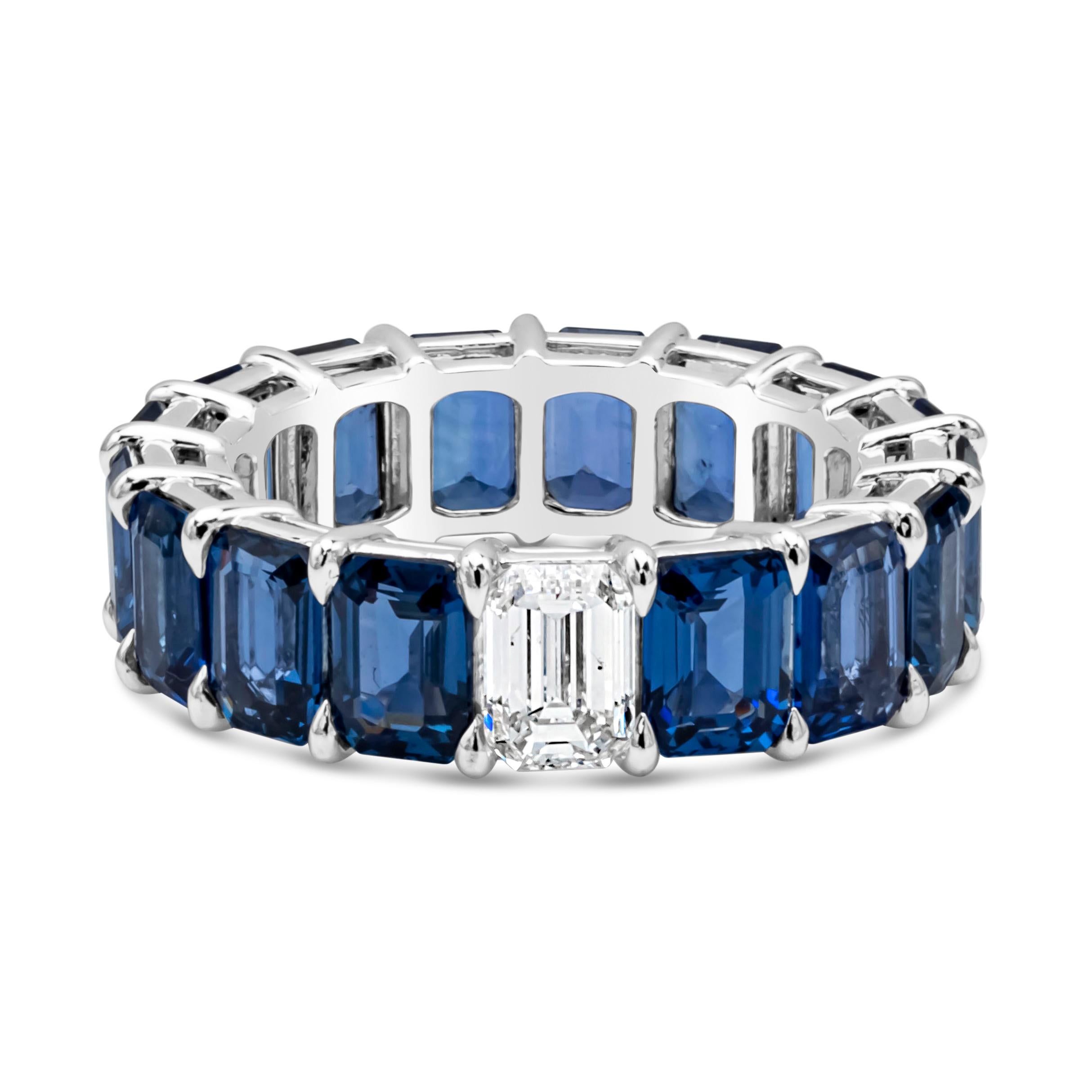 An appealing eternity wedding band style showcasing a color rich emerald cut blue sapphires weighing 10.56 carats total, set in a shared prong setting. Accented with a single Emerald cut diamond weighing 0.71 carat, E Color and SI2 in Clarity. Made