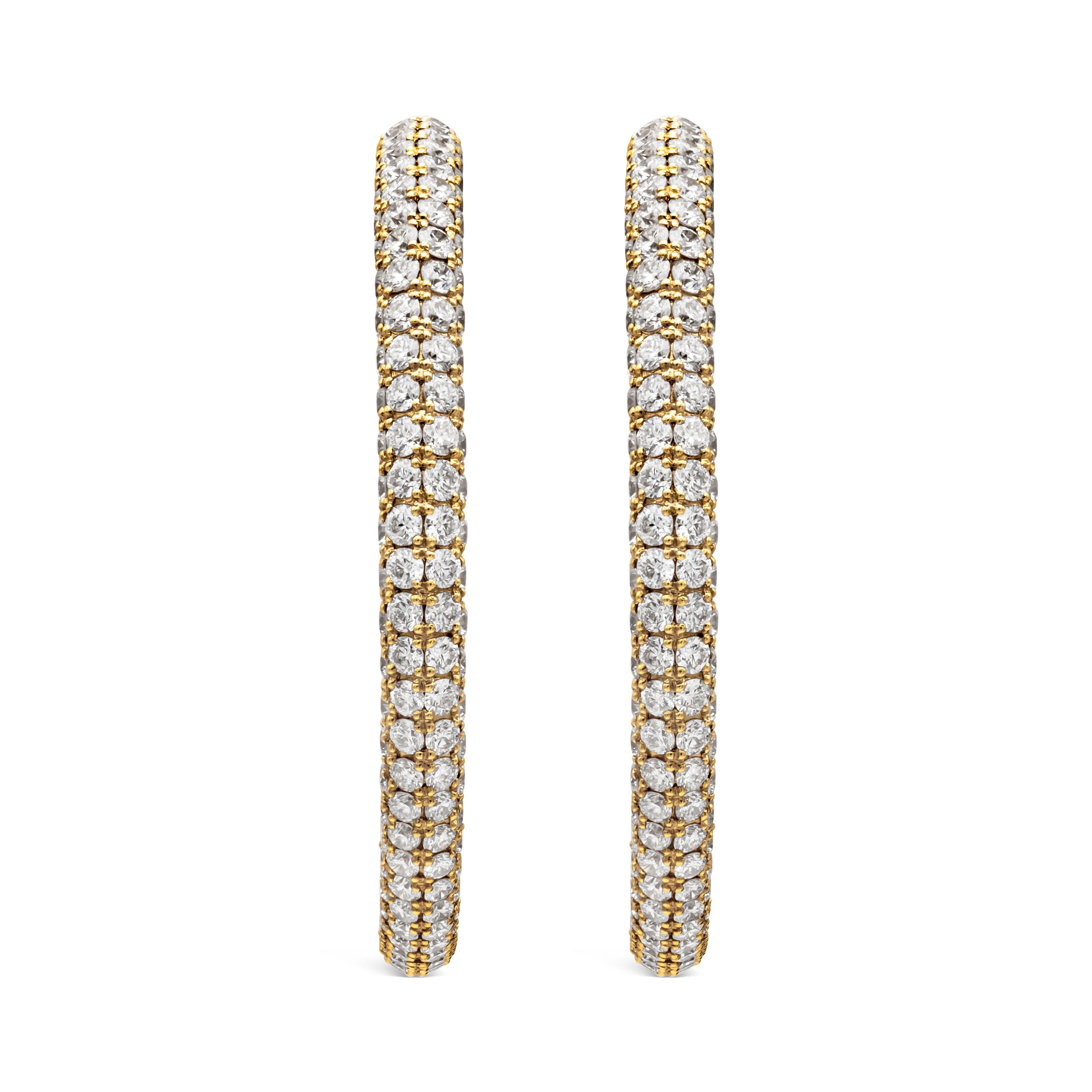A classic hoop earrings showcasing a brilliant round diamonds weighing 10.58 carats total, set in a micro-pave set in the inside and the outside. Finely made in 18k yellow gold.

Style available in different price ranges. Prices are based on your