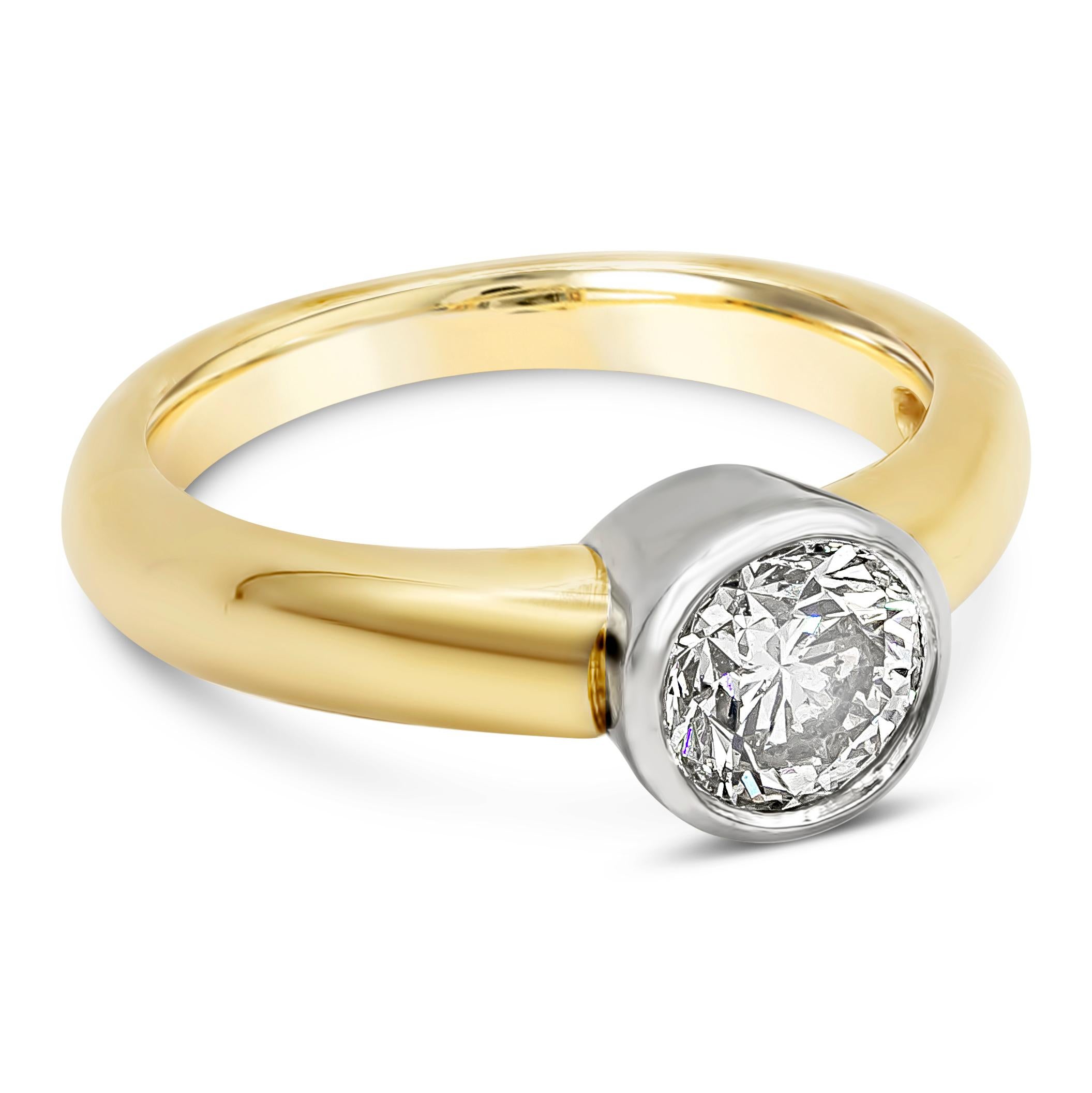A simple solitaire engagement ring features a 1.06 carat round diamond. Bezel set in a rounded fit in 14K White Gold. Band made with 14K Yellow Gold. Size 5.75 US.

Style available in different price ranges. Prices are based on your selection.