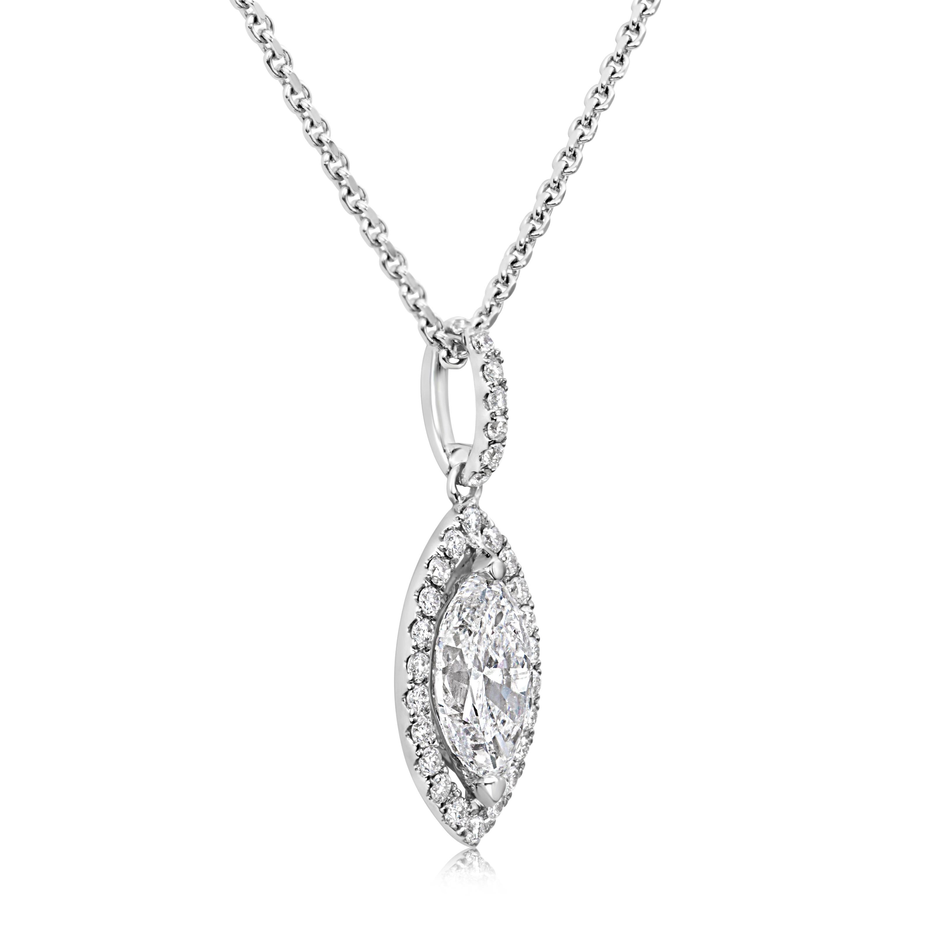 A lovely pendant necklace, featuring a 1.06 carats marquise cut diamond, set on a two prong setting. Accented by a halo of round cut diamonds and a diamond encrusted bail, set in an open-work design. Accent diamonds weigh 0.22 carat total. Finely