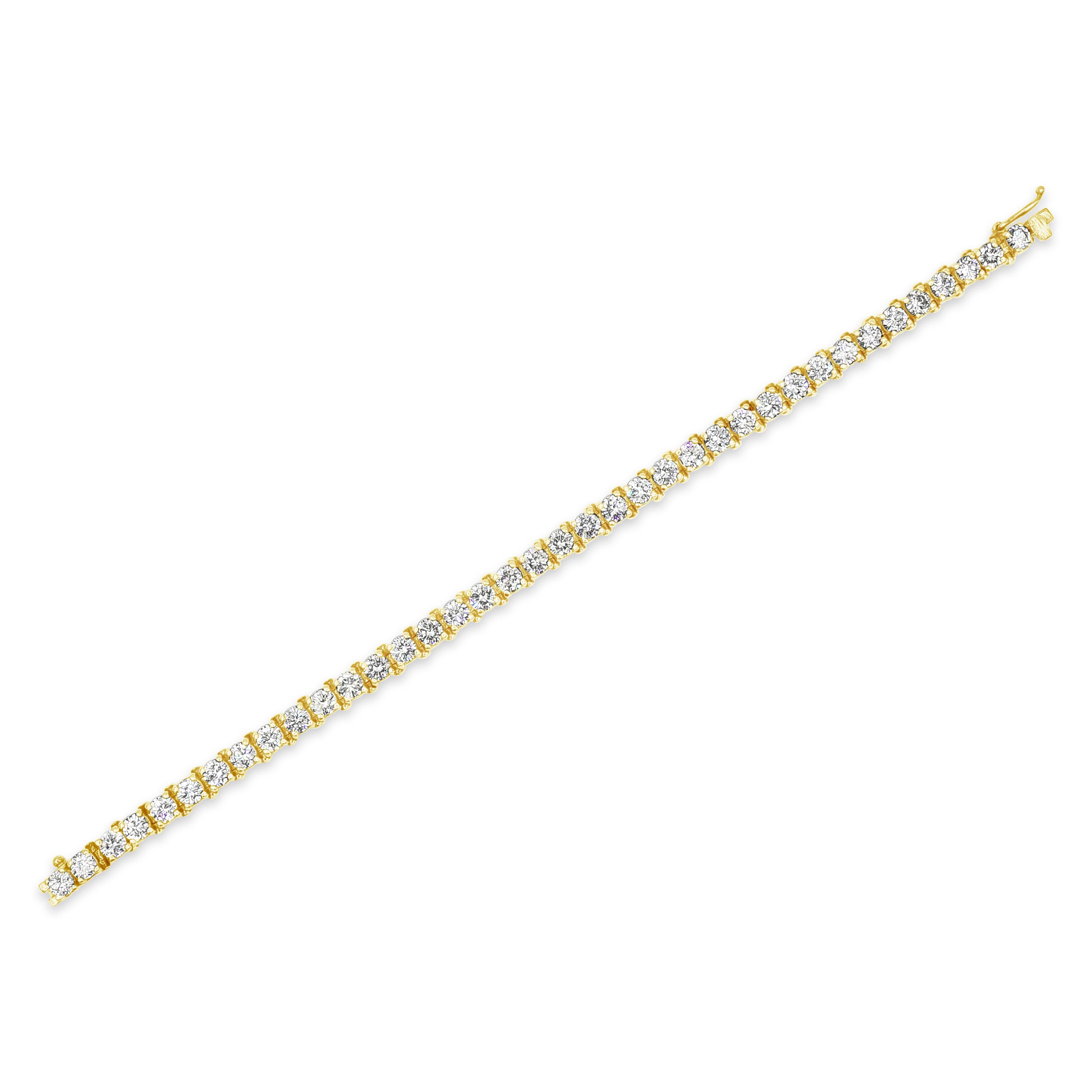 A classic and simple tennis bracelet style featuring a row of round brilliant diamonds weighing 11.00 carats total, G+ Color and VS+ in Clarity. Set in a four-prong basket setting. Made in 14K Yellow Gold and 7 inches in Length.

Roman Malakov is a