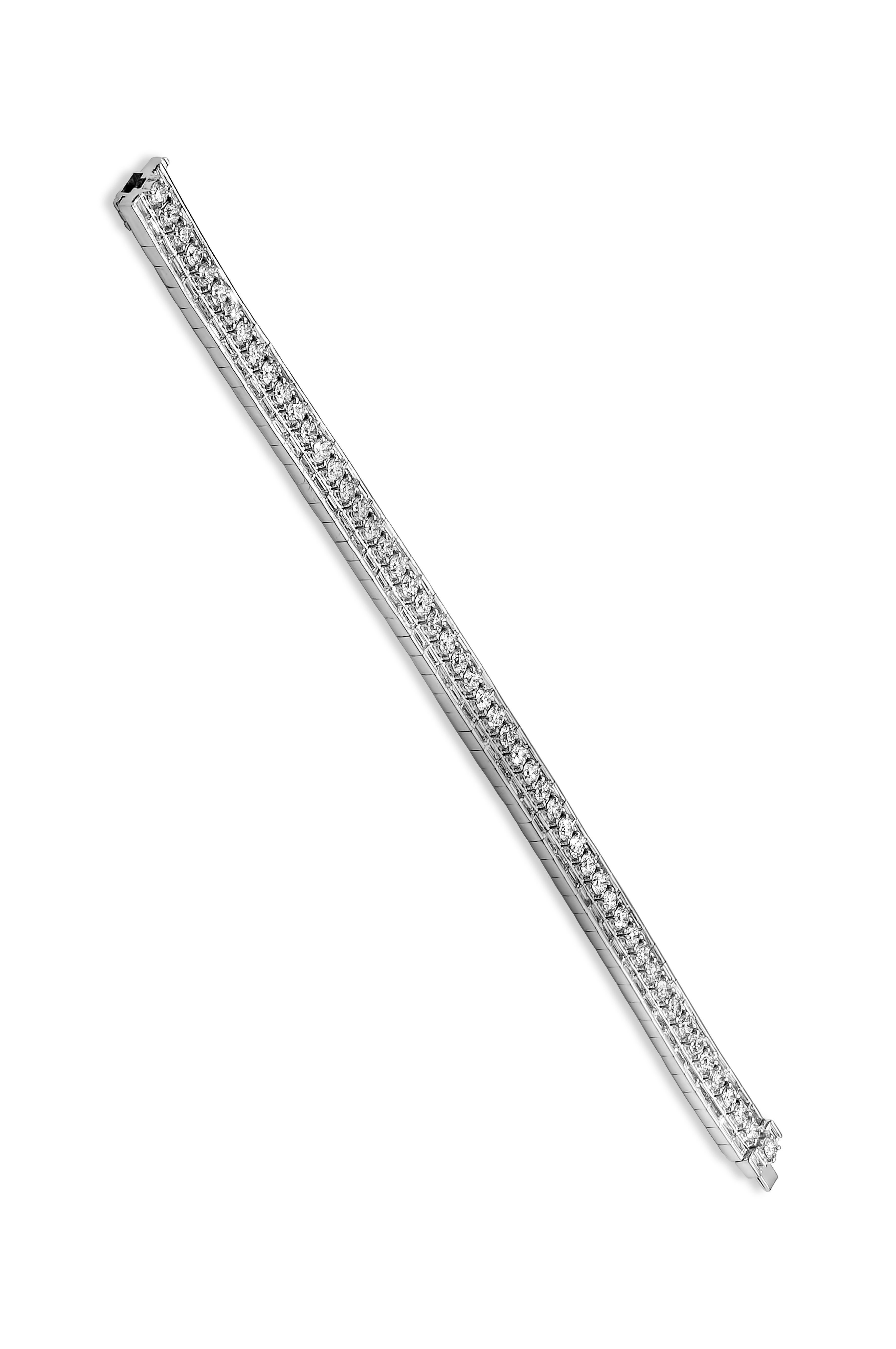 A fashionable tennis bracelet showcasing a row of round brilliant diamonds, set in-between baguette diamonds, weighing 11.14 carats total. Made in 18K White Gold and 7 inches in Length.

Roman Malakov is a custom house, specializing in creating