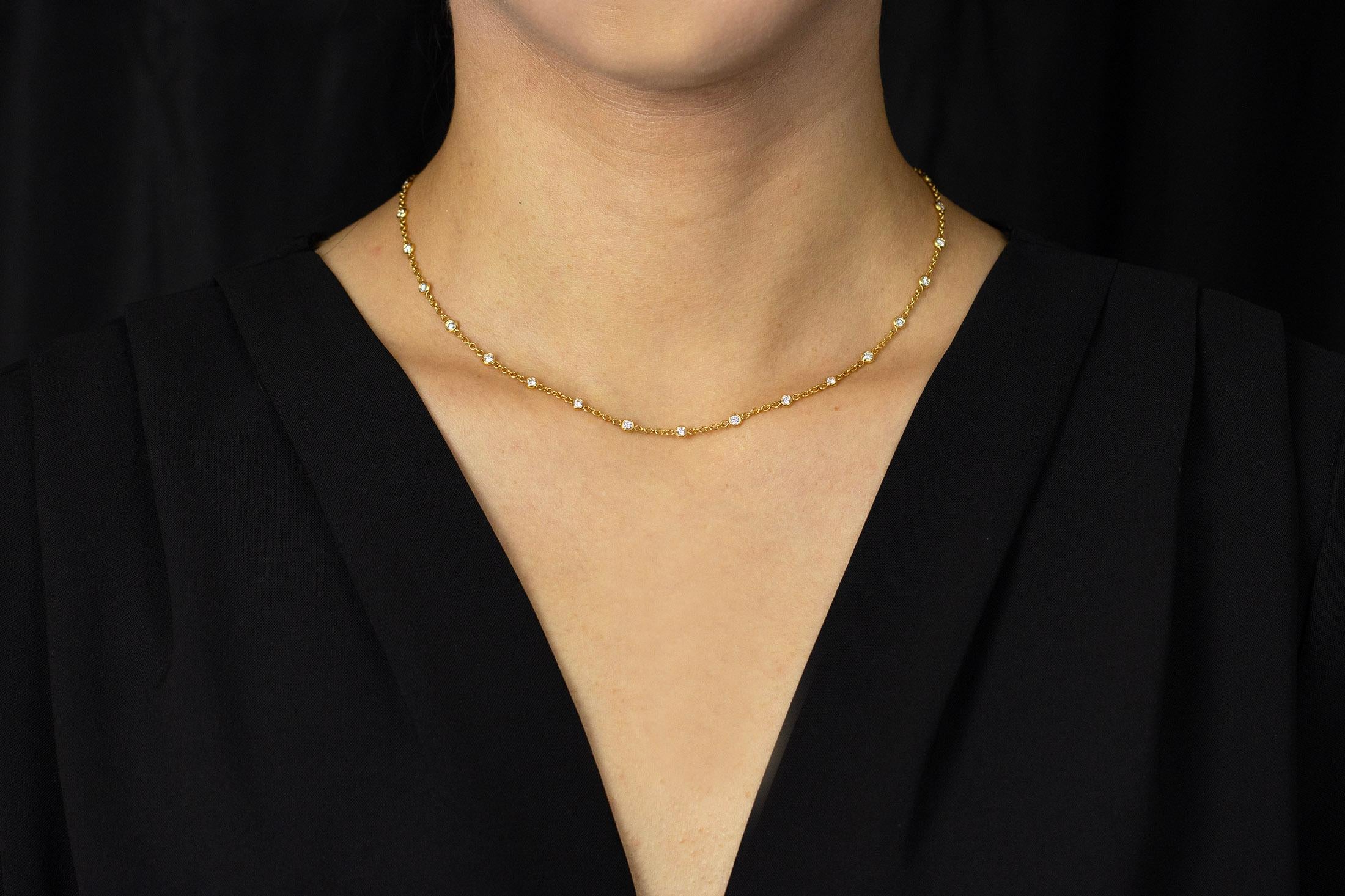 A simple necklace that packs a lot of sparkle; a line of brilliant diamonds bezel set in 18k yellow gold are perfectly spaced for that delicate and feminine look and finish. Diamonds weigh 1.12 carats total. Approximately 18 inches in length.

Style
