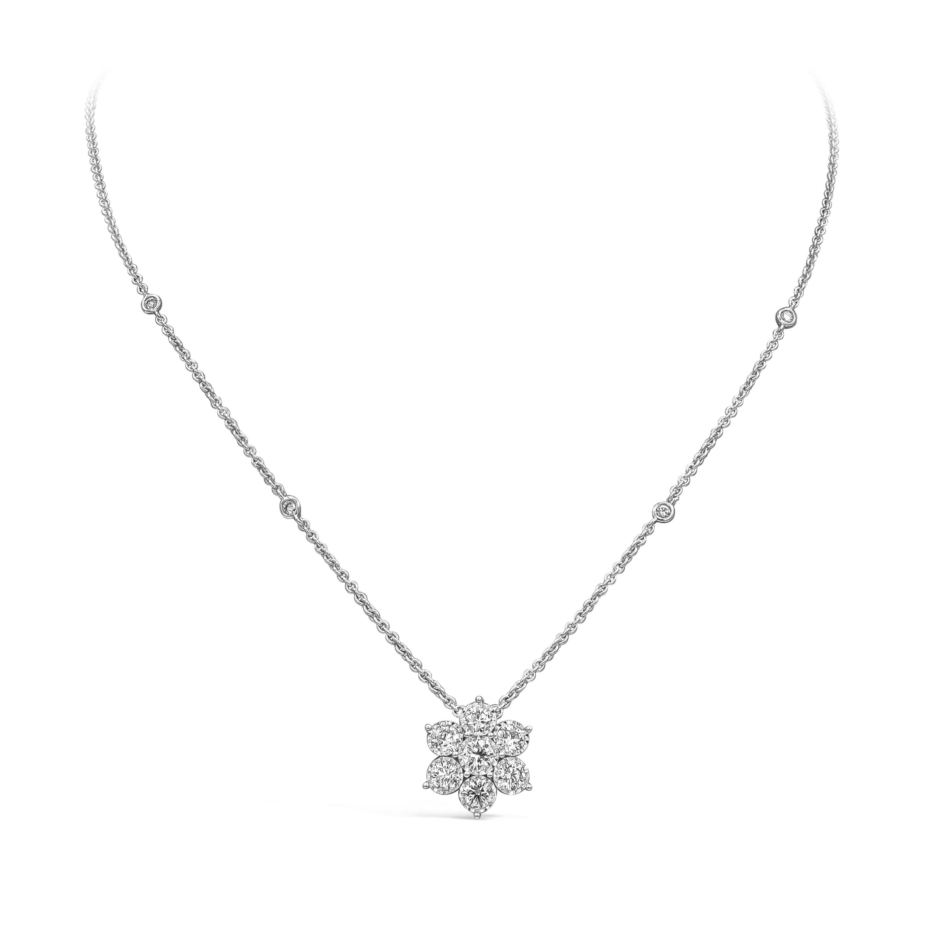 A modern flower pendant design showcasing round brilliant diamonds, set in a bezel accented with a chic geometric pattern design. Suspended on an 16 inch diamonds by the yard chain. Diamonds weigh 1.12 carats total. Mounted in 18K white gold.

Roman