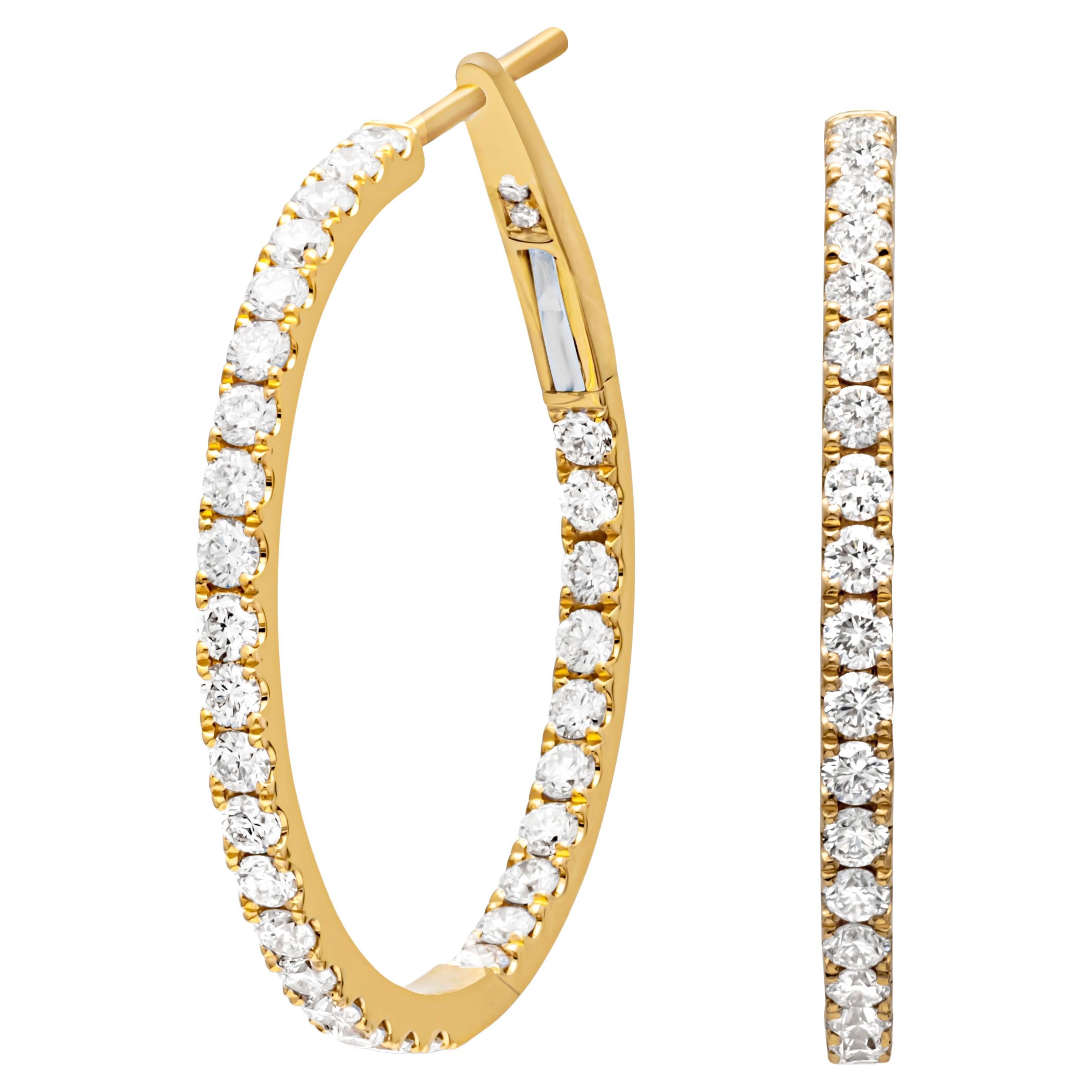 A timeless piece of jewelry showcasing a row of round brilliant diamonds, set inside and out in a traditional four prong basket setting. Diamonds weigh 1.16 carats total, G color and VS-SI1 in clarity. Finely made in 18k Yellow Gold and 1 inches in