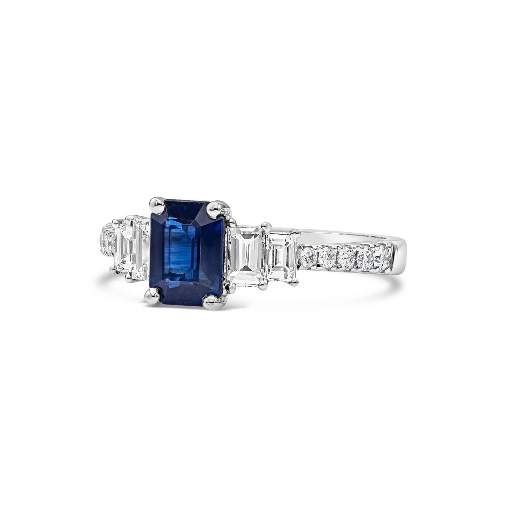 Features a 1.17 carat vibrant blue sapphire flanked by step-cut diamonds on either side. Set in a diamond encrusted band made in 18k white gold. Diamonds weigh 0.61 carats total and are approximately G color, VS clarity. Size 6.5 US.

Roman Malakov