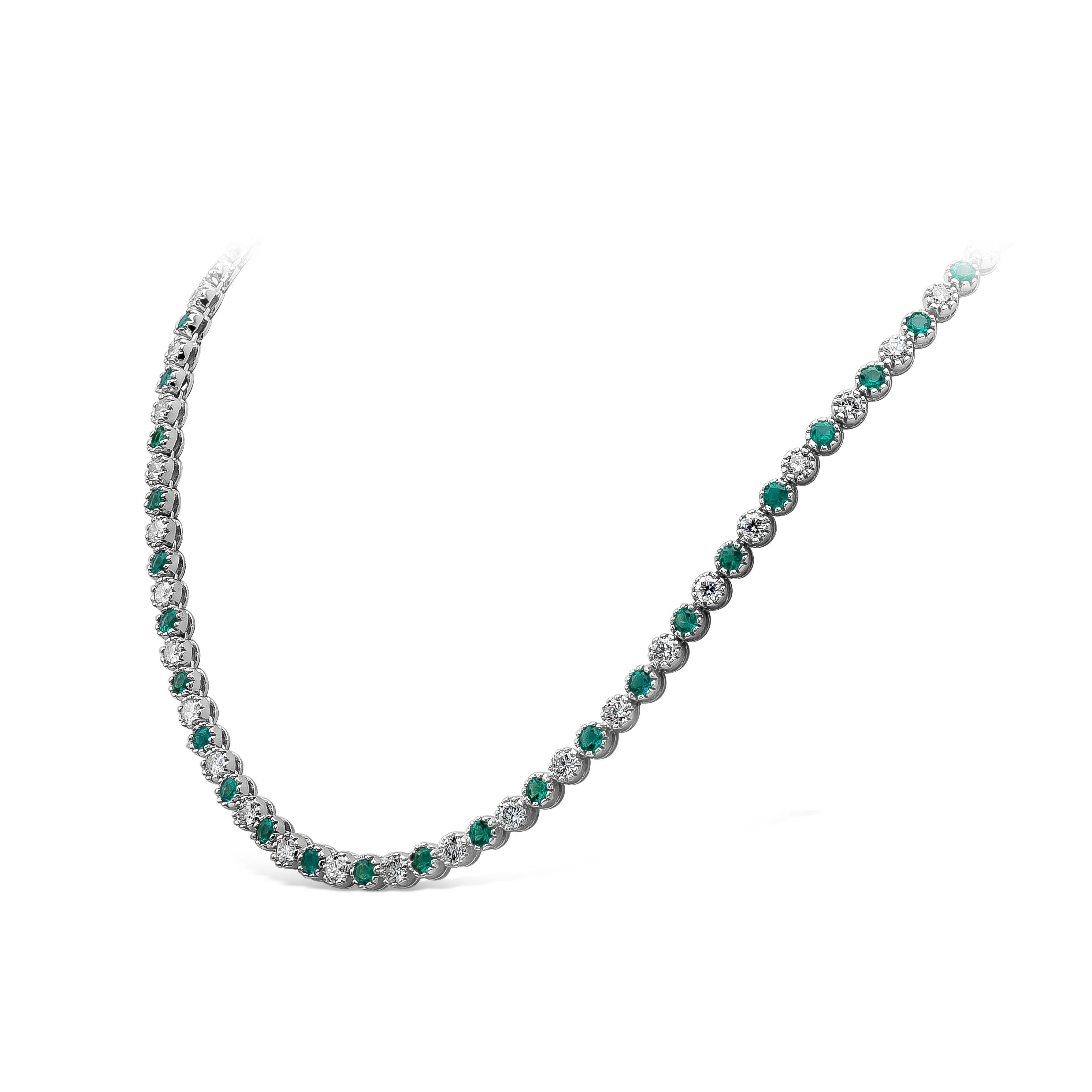 A beautifully crafted and refined tennis necklace, featuring vibrant green emeralds weighing 5.39 carats total alternating with round brilliant diamonds weighing 6.43 carats total with F-G color and SI1 clarity. Set on 18K white gold and 16.75