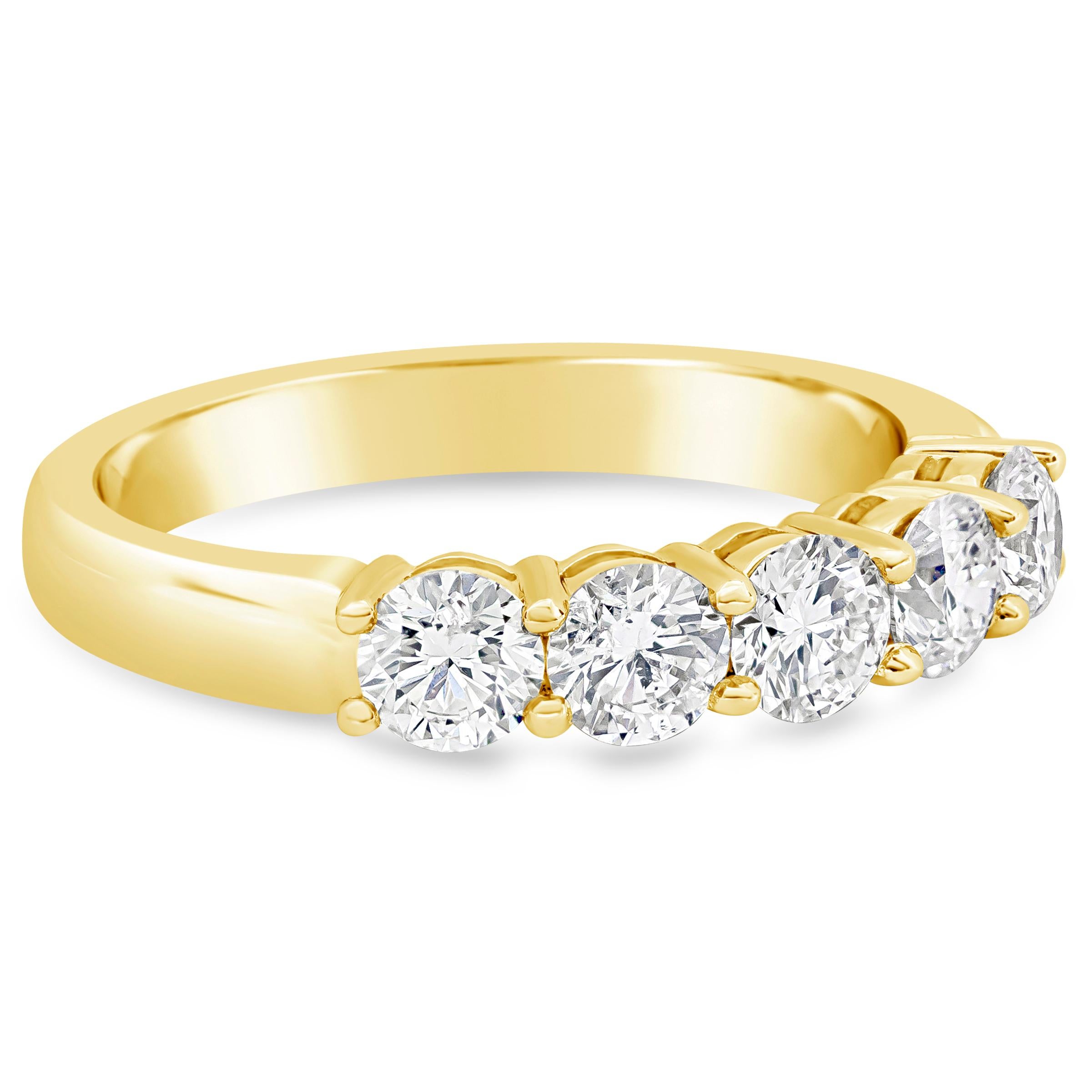 A design that surpasses time because of its simplicity and brilliance. Five sparkling diamonds weighing 1.19 carats total, E Color and SI in Clarity. Set in a band with angular edges for a sleek and comfortable fit in a shared-prong. Made with 18K