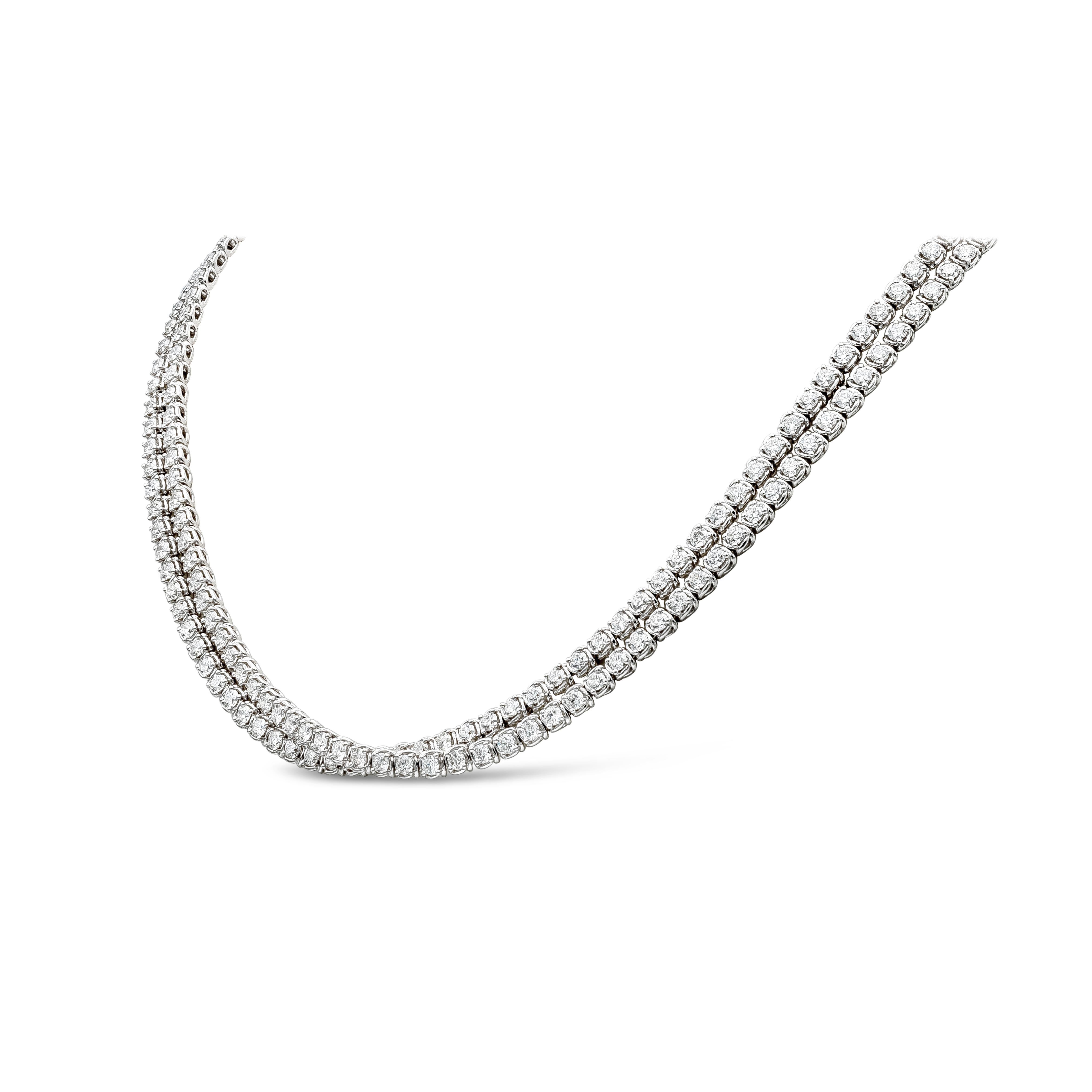 Un collier de tennis croisé à la mode et élégant mettant en valeur 238 diamants ronds de taille brillant. Les diamants pèsent 11,90 carats au total, de couleur F-G et de pureté VS-SI. Fabriqué en or blanc 18 carats. 16 pouces de longueur.

Roman