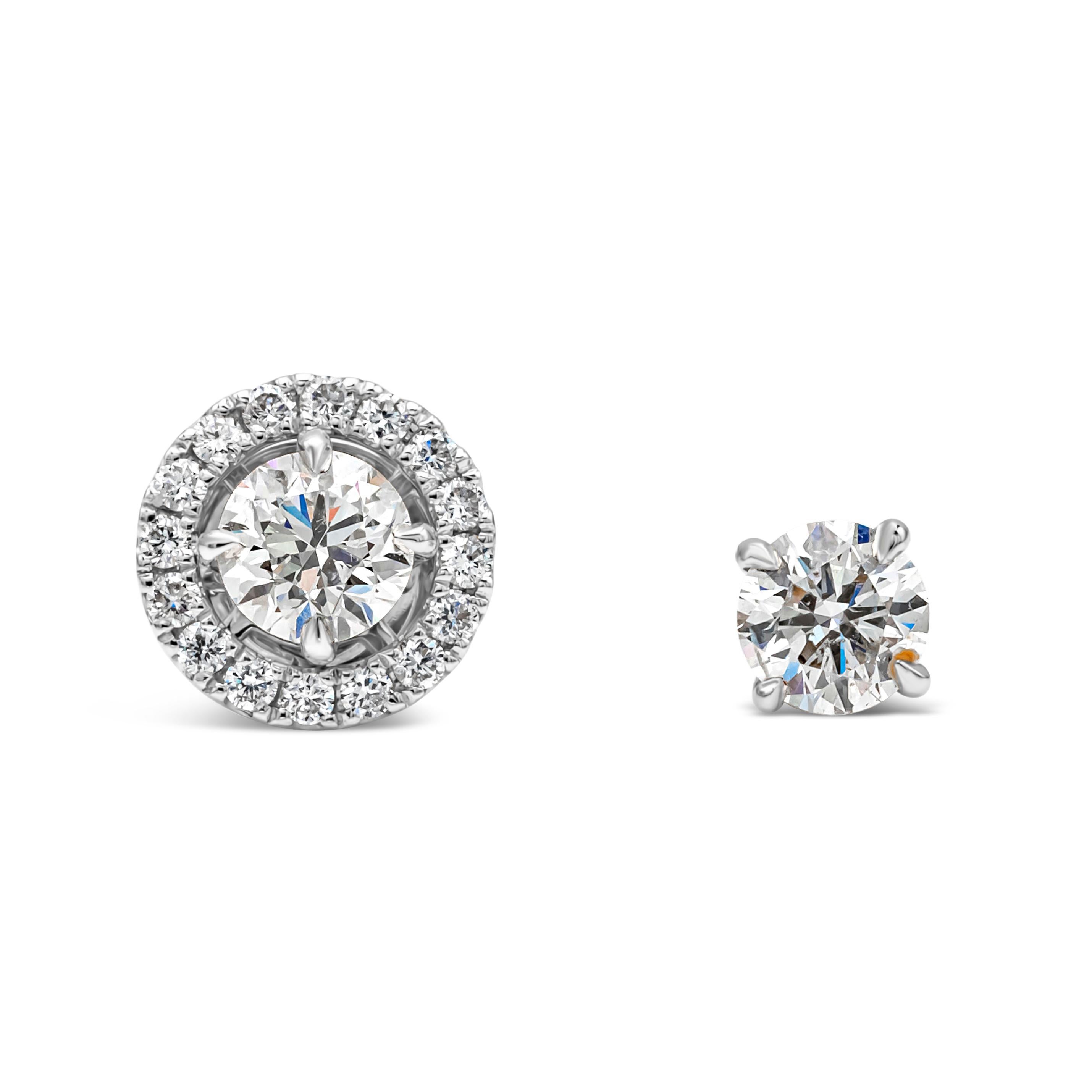 A simple and versatile pair of stud earrings showcasing 1.20 carats total brilliant round cut diamond, surrounded by a single row of brilliant round diamonds, in a halo design, the jacket of the center stone can be removable. Beautifully set in a