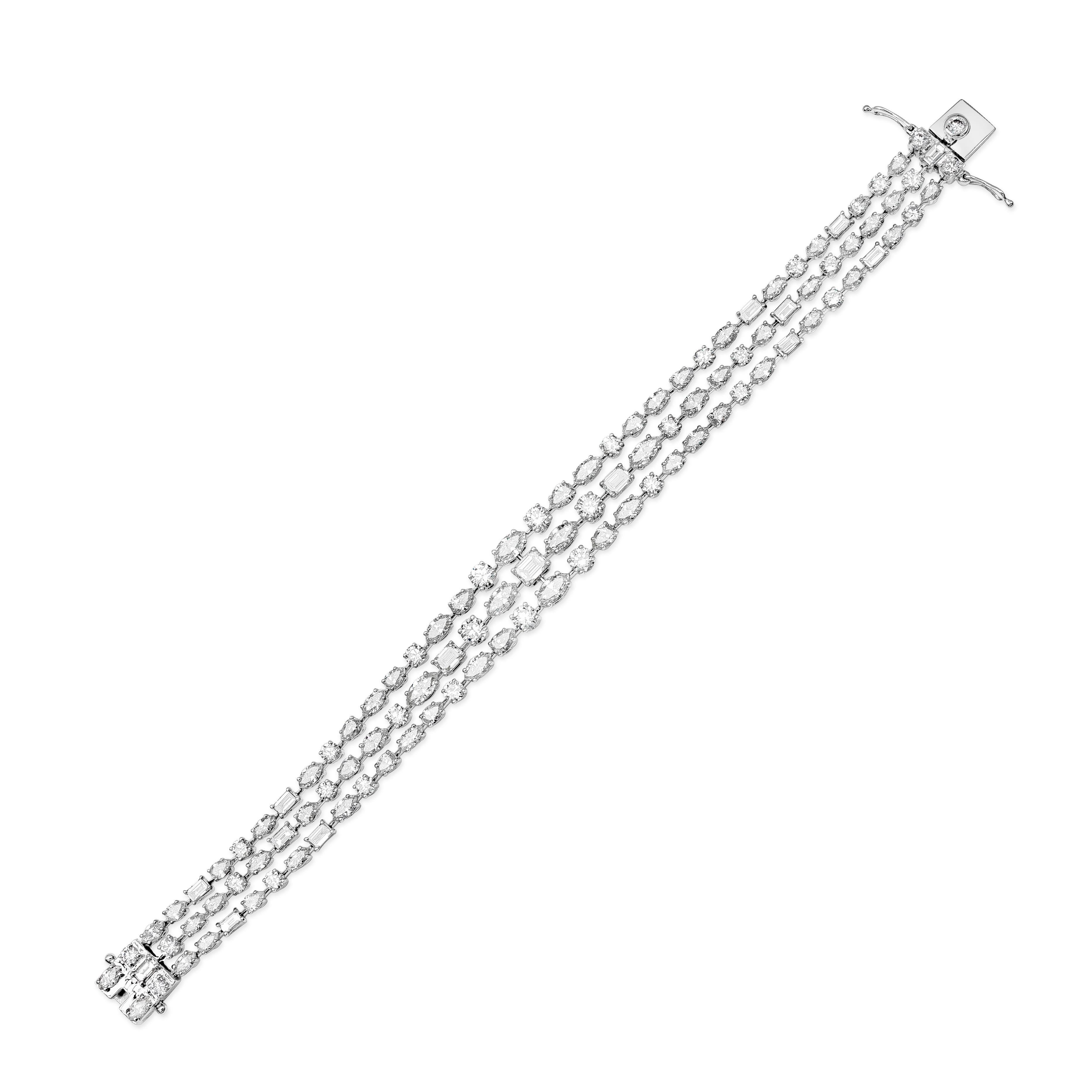 This elegant and fashionable bracelet showcasing three-rows of Fancy shape diamonds that graduate larger as it gets to the center. Diamonds weigh 12.03 carats total and are approximately G-H color, VS-SI clarity. Made with 18k White Gold.

Roman