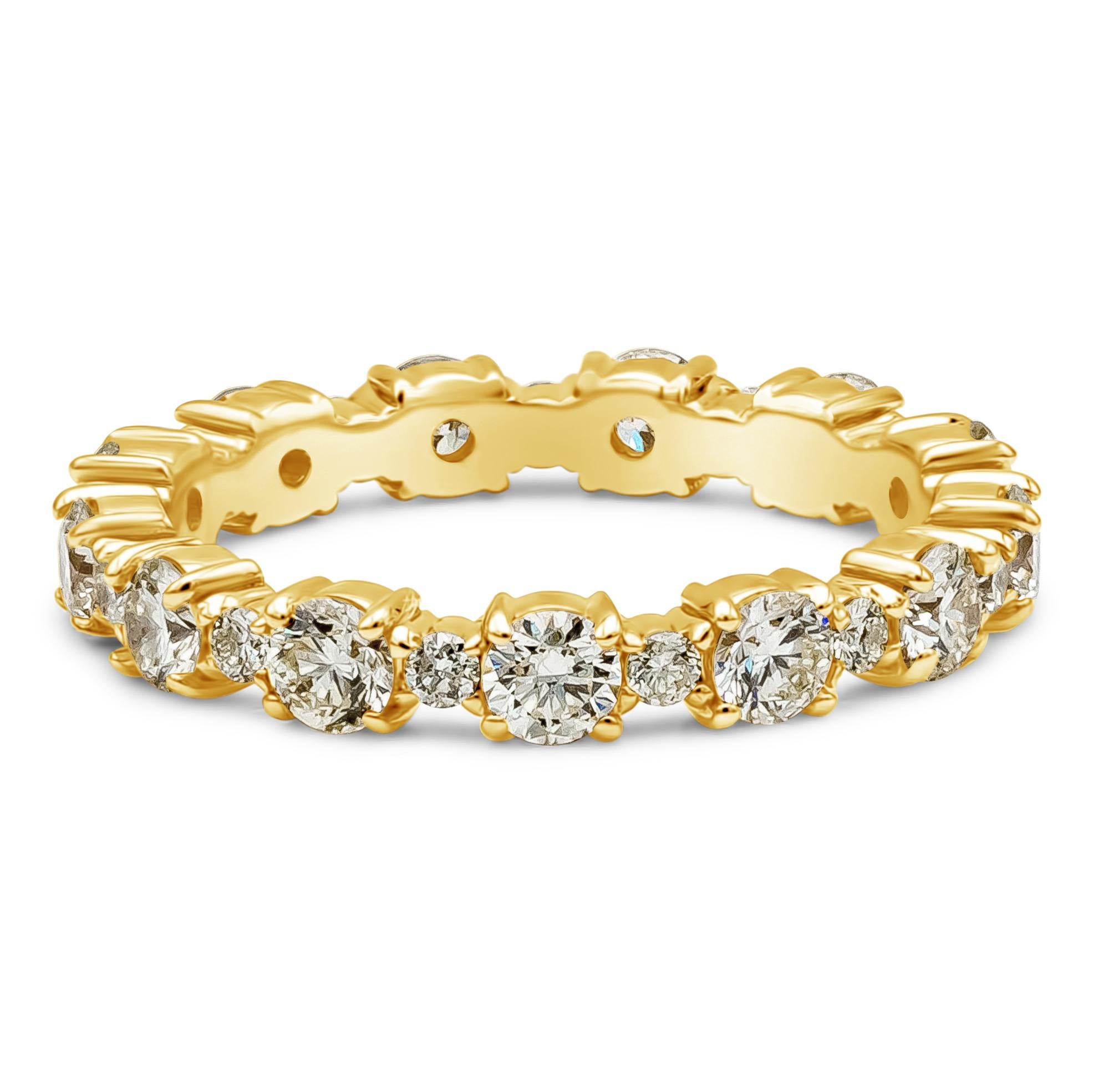 A classic and timeless wedding band style showcasing a row of round brilliant cut diamonds weighing 1.23 carats total, O-P Color and VS in Clarity. Alternating in between is a small round diamond, Eternity set. Made with 14K Yellow Gold. Size 4.5