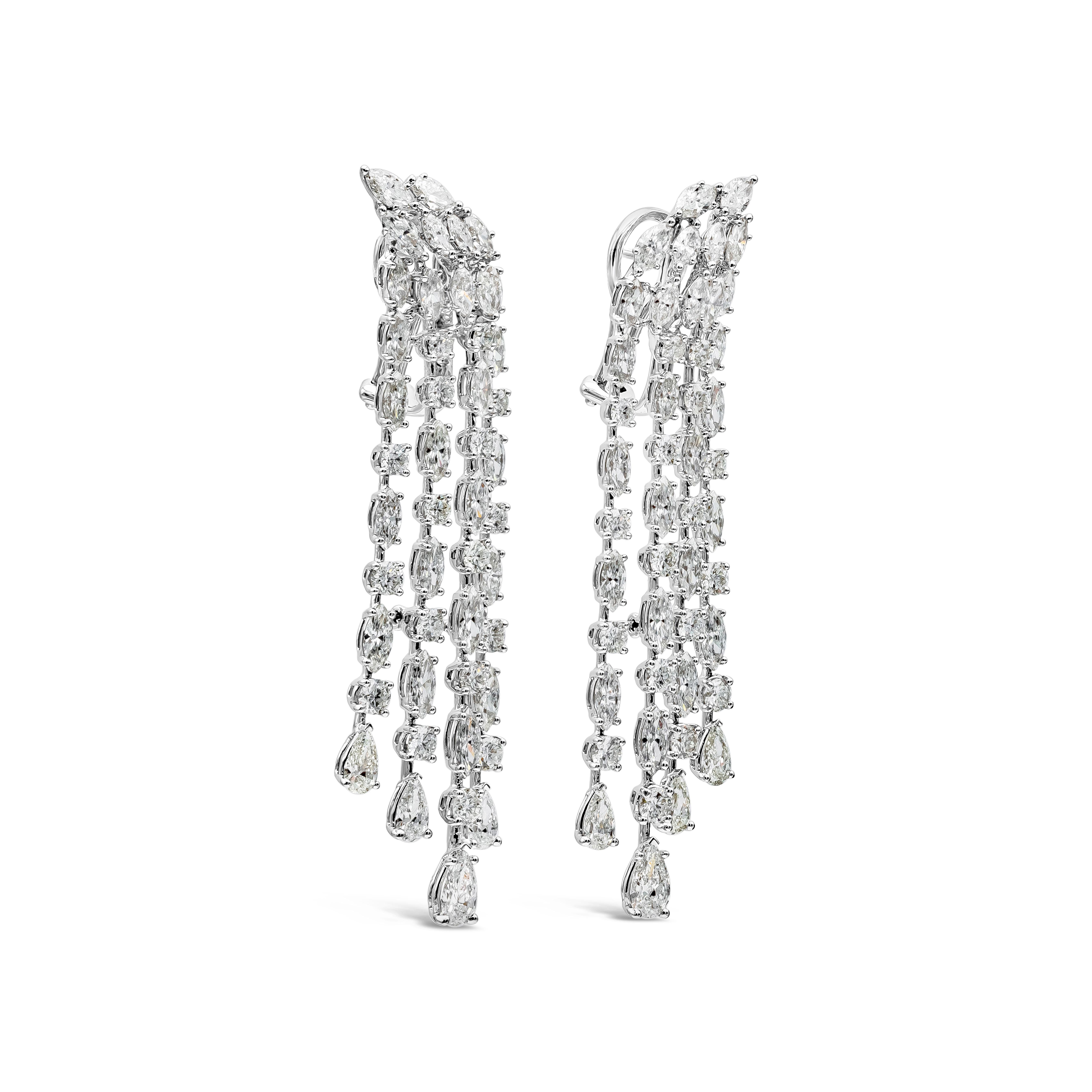 This sophisticated piece of jewelry showcasing four-rows of mixed pear, marquise cut and round shape diamonds set in an elegant chandelier design. Diamonds weighs 12.53 carats total. The pair is 67mm in length and 12mm in width. The weight of this