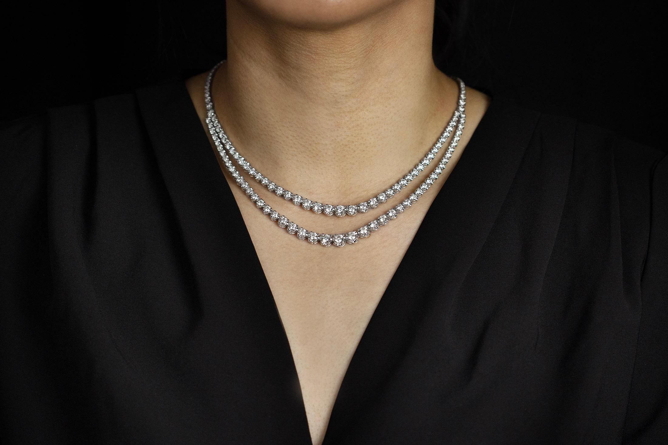 A sophisticated diamond necklace showcasing a double strand with graduating diamonds weighing 12.94 carats total, G Color and SI in Clarity. Each diamond securely sits in a 4 prong basket. Perfectly Made in 18K White Gold. 

Roman Malakov is a