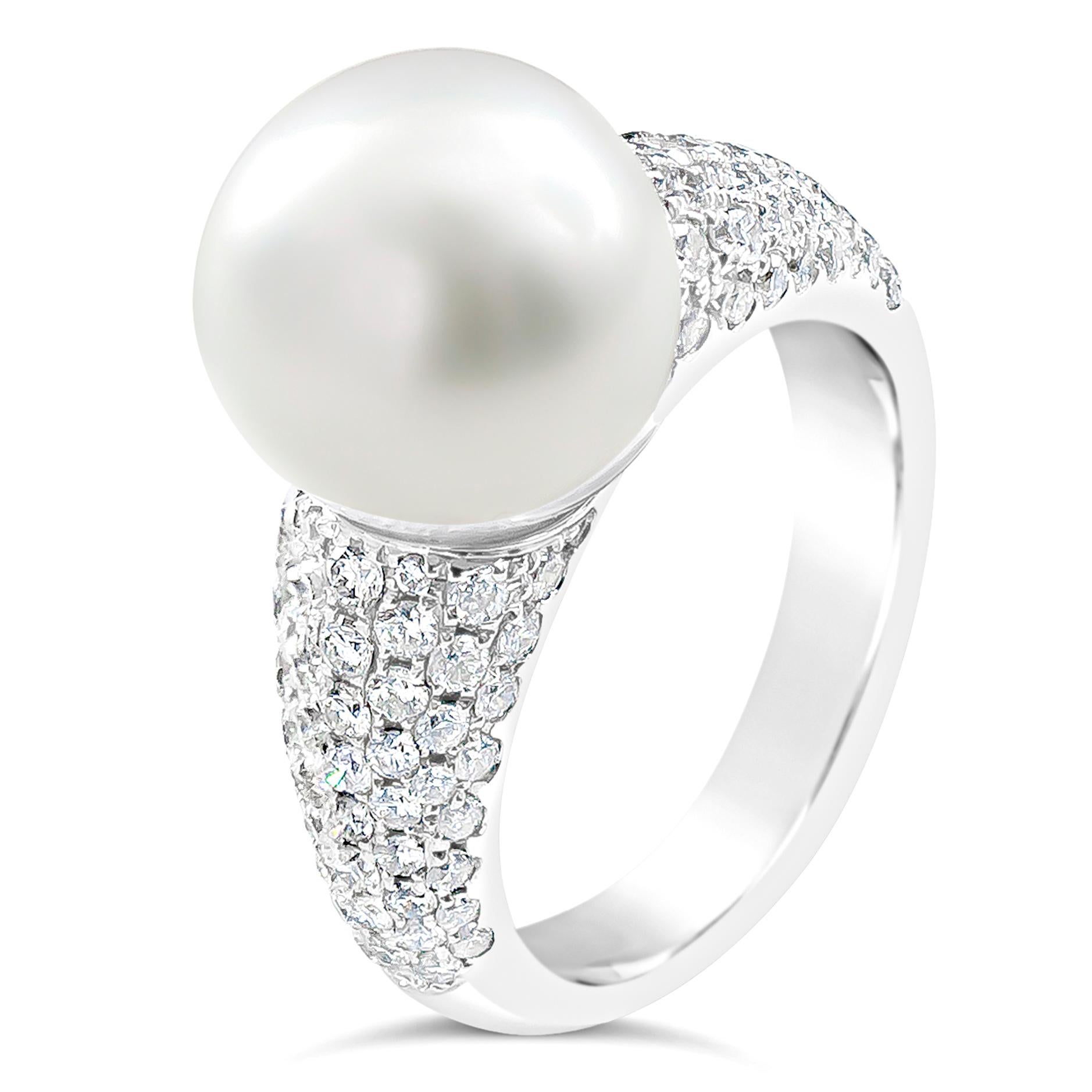 Features a beautiful 12 millimeter cultured south sea pearl set in a lustrous 18k white gold band accented with round brilliant diamonds in a micro-pave design. Diamonds weigh 1.14 carats total.Size 6.5 US resizable upon request.

Roman Malakov is a
