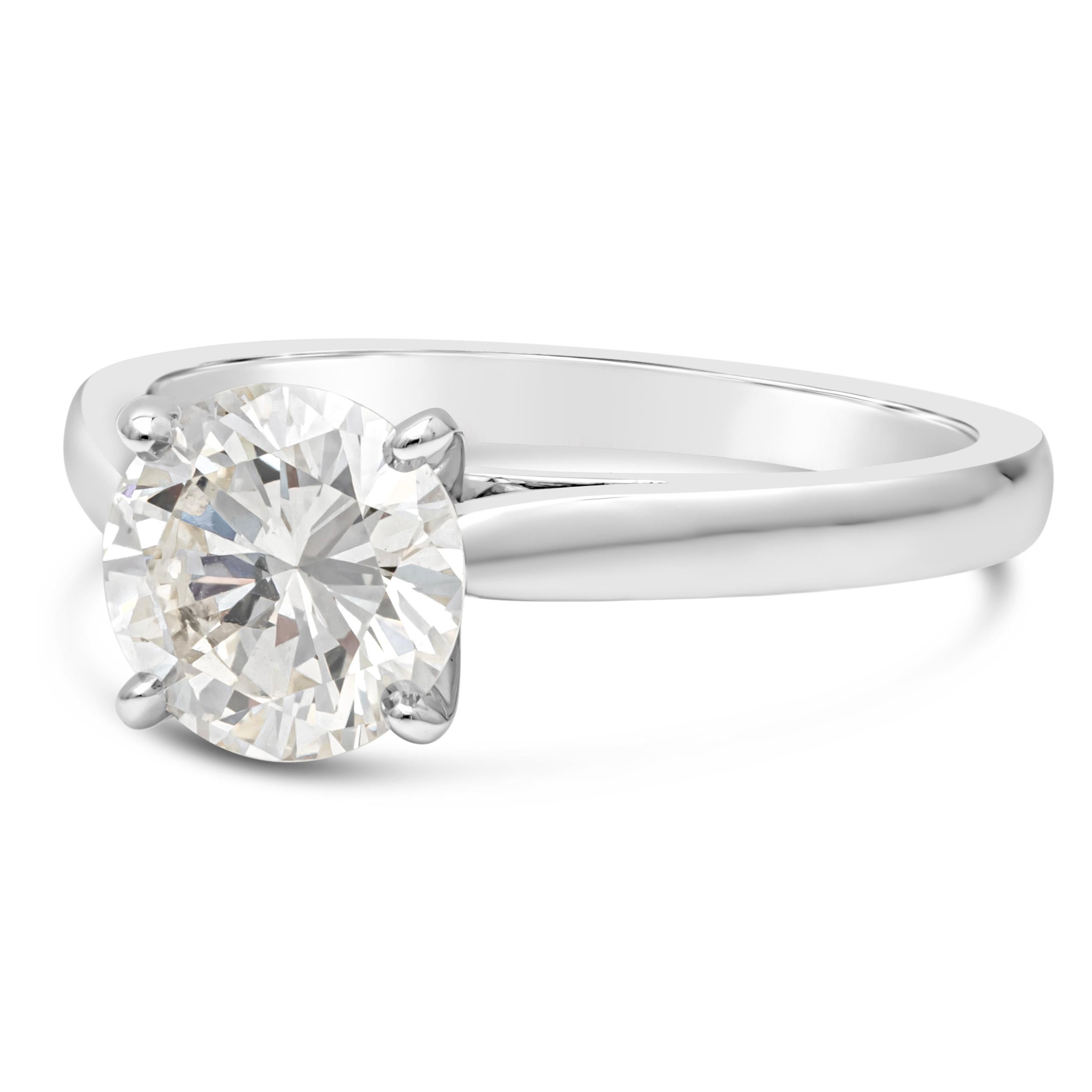 A classic solitaire engagement ring showcasing a 1.30 carat round brilliant diamond,  GIA certified as I Color and SI1 in clarity.  Set in a four prong basket setting. Finely made in 14K White Gold. Size 5.75 US resizable upon request. 

Roman