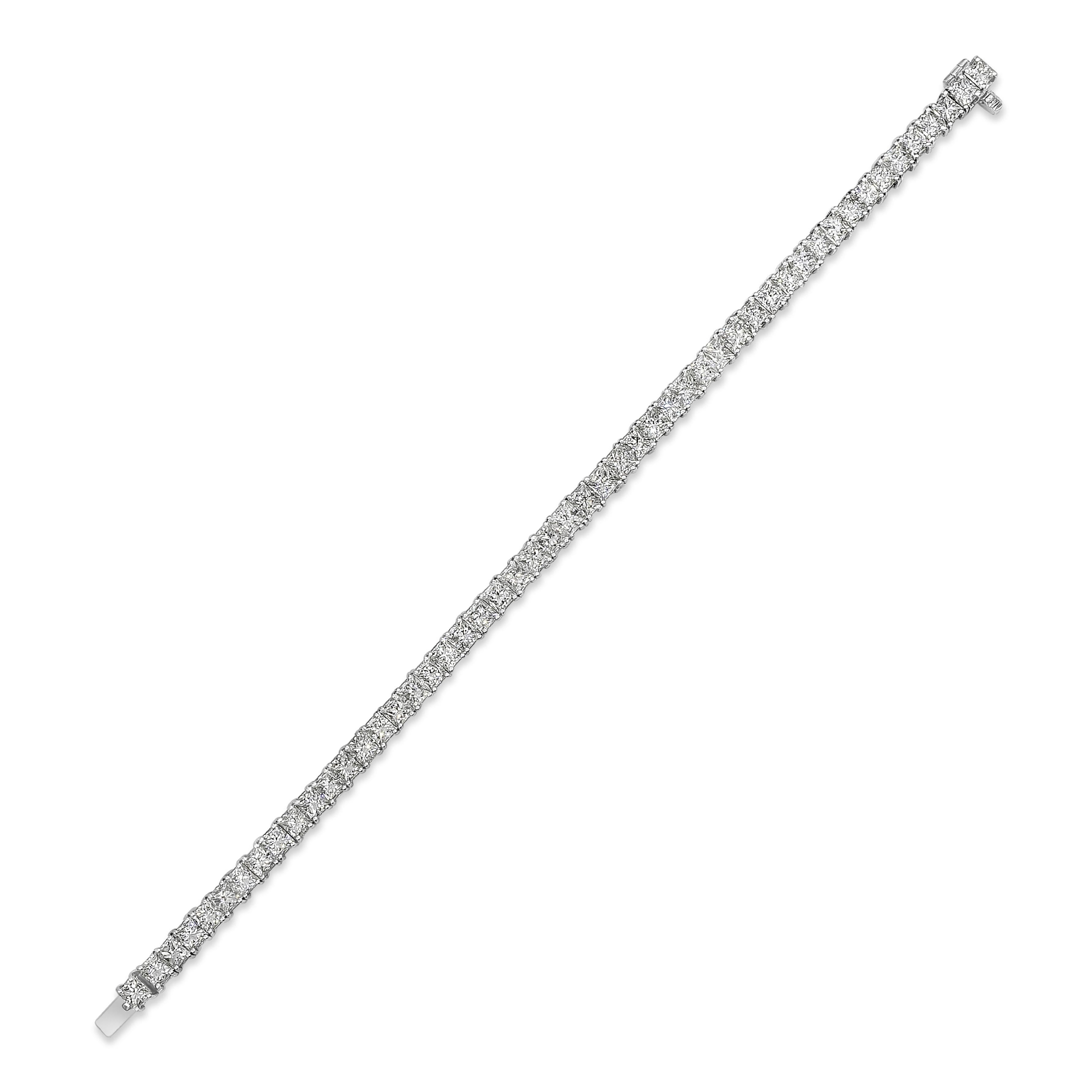 Classic tennis bracelet showcasing princess cut diamonds weighing 13.21 carats total, E-F Color and VS in Clarity, set in a classic four-prong basket setting. Finely made in 18K White Gold and 7 inches in Length.

Roman Malakov is a custom house,