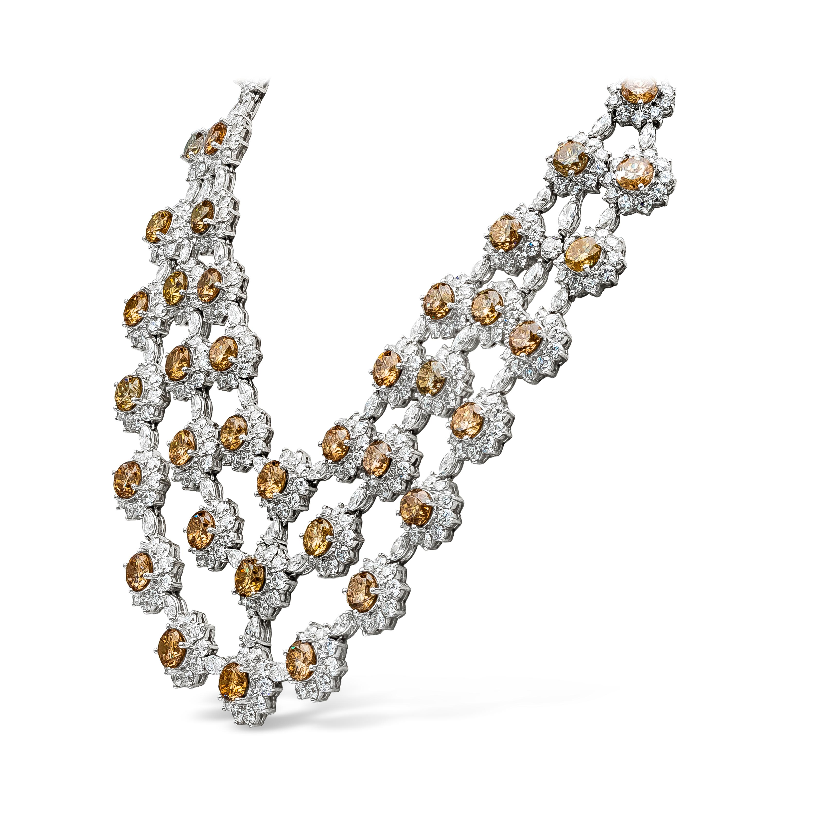 This beautiful necklace features 47 natural brown round diamonds weighing 68.57 carat total. Each brown diamond surrounded by a cluster of white round diamonds in a floral motif and spaced by white marquise diamonds. Total weight of white diamonds