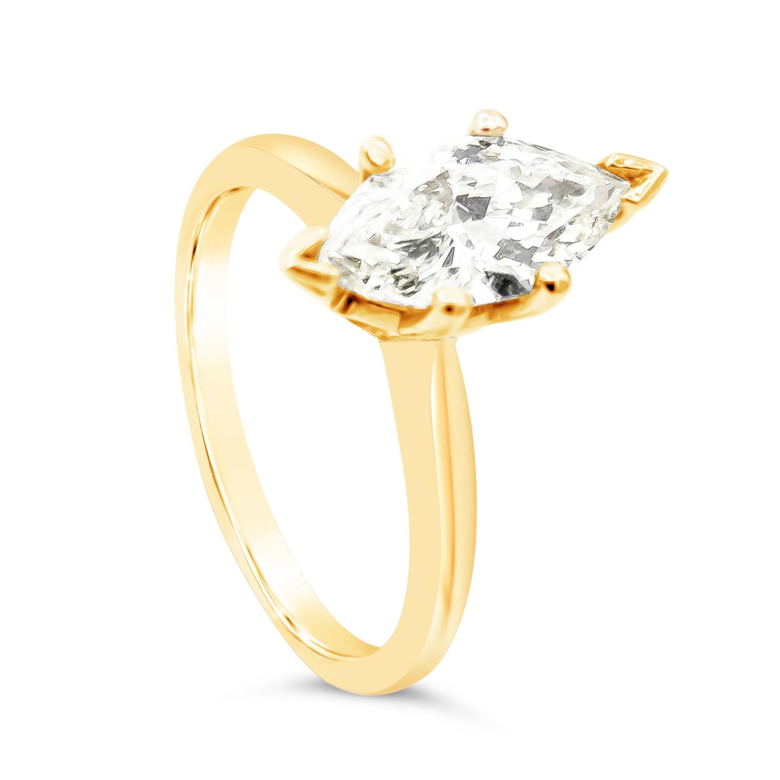 A beautiful and classy solitaire engagement ring style showcasing a marquise cut diamond weighing 1.36 carats, set in a timeless six prong basket setting and Finely Made in 18K Yellow Gold. Size 6 US resizable upon request.

Style available in