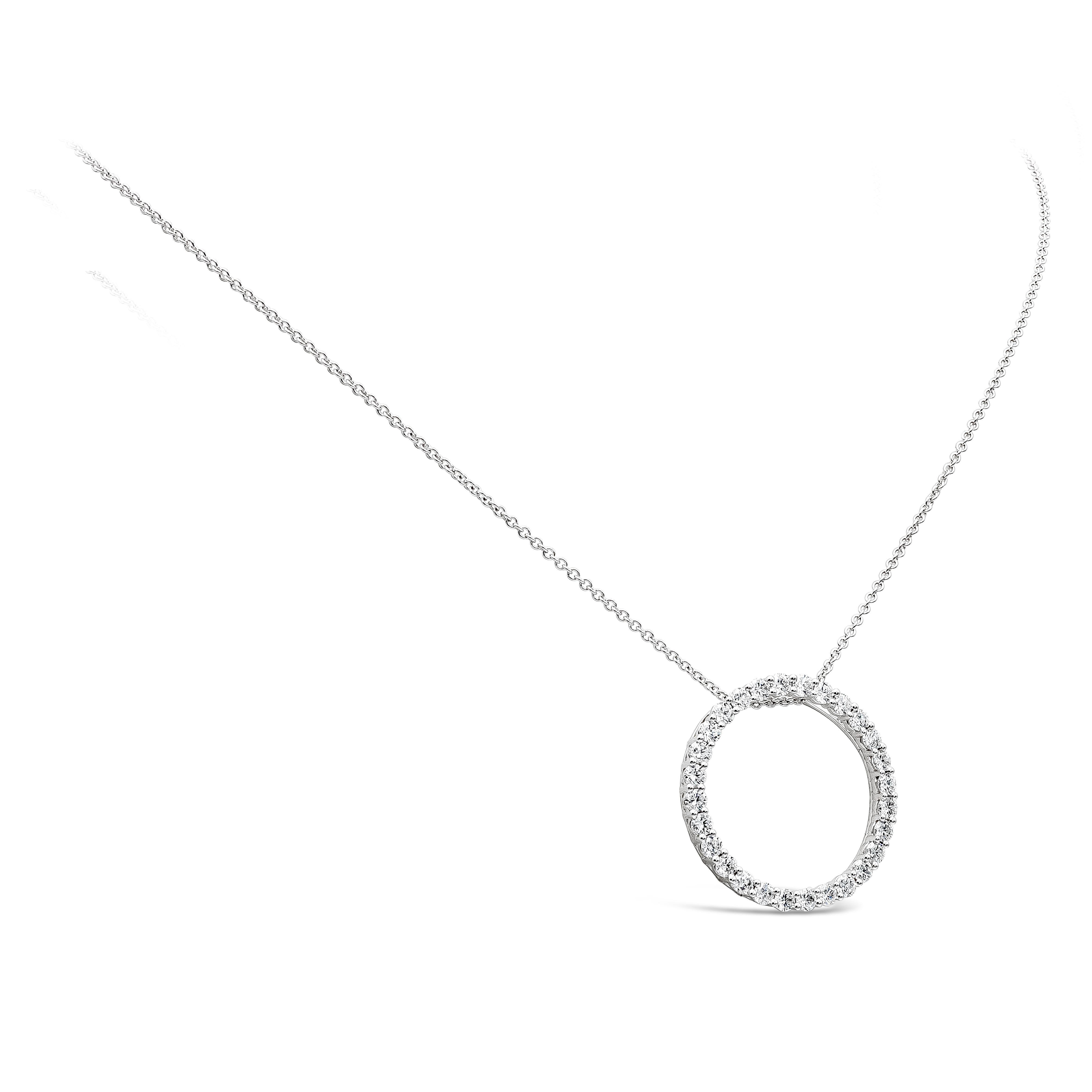 A stylish pendant necklace showcasing a row of round brilliant cut diamonds, set in an open-work, circular design. Diamonds weigh 1.40 carats total, F-G Color and VS-SI in Clarity. Made with 18K White Gold. 16 inches in Length.

Roman Malakov is a