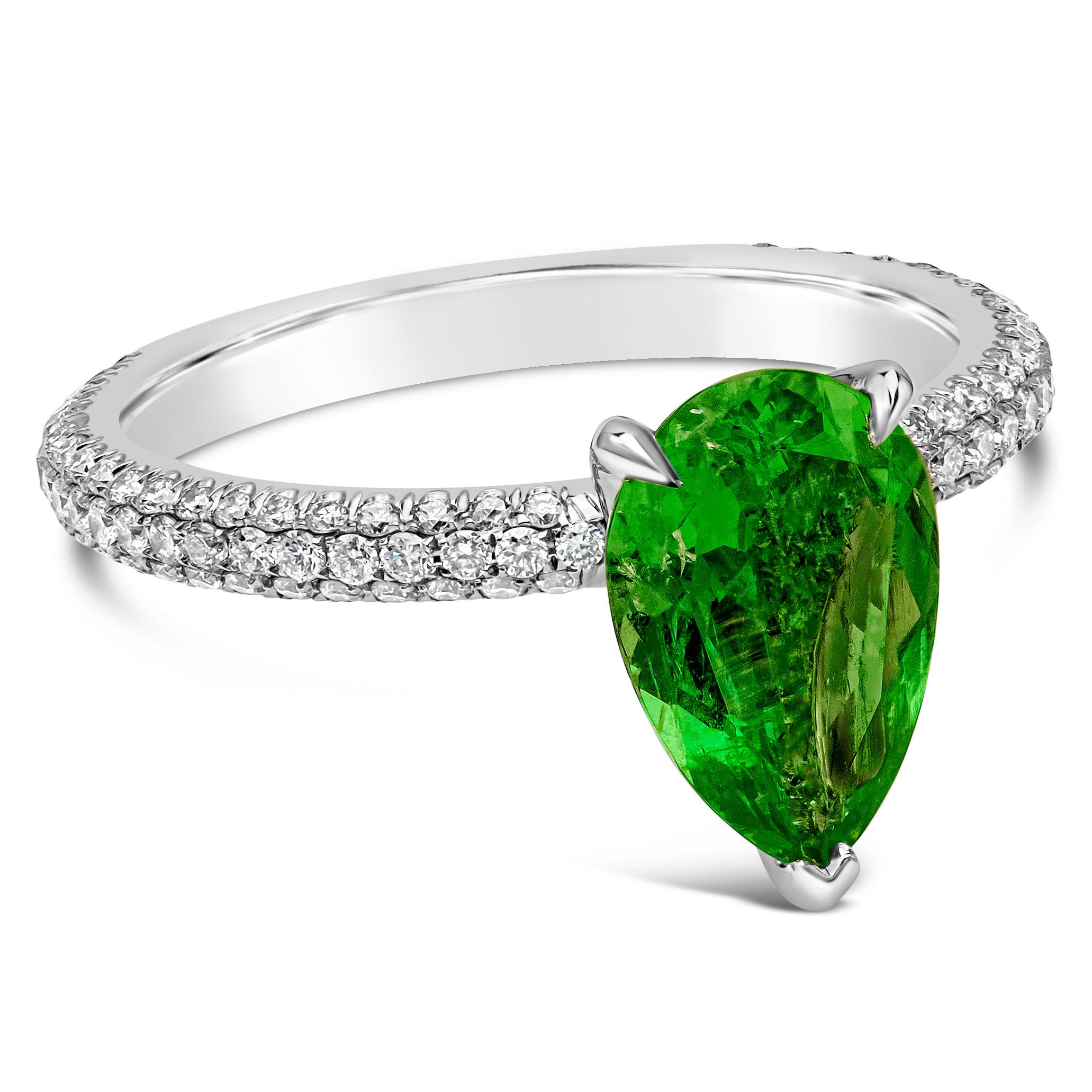 Features a vibrant 1.42 carat pear shape colombian green emerald, SI in Clarity. Accented with brilliant round diamonds weighing 0.58 carats total, F Color and VS in Clarity. Size 6 US

Roman Malakov is a custom house, specializing in creating