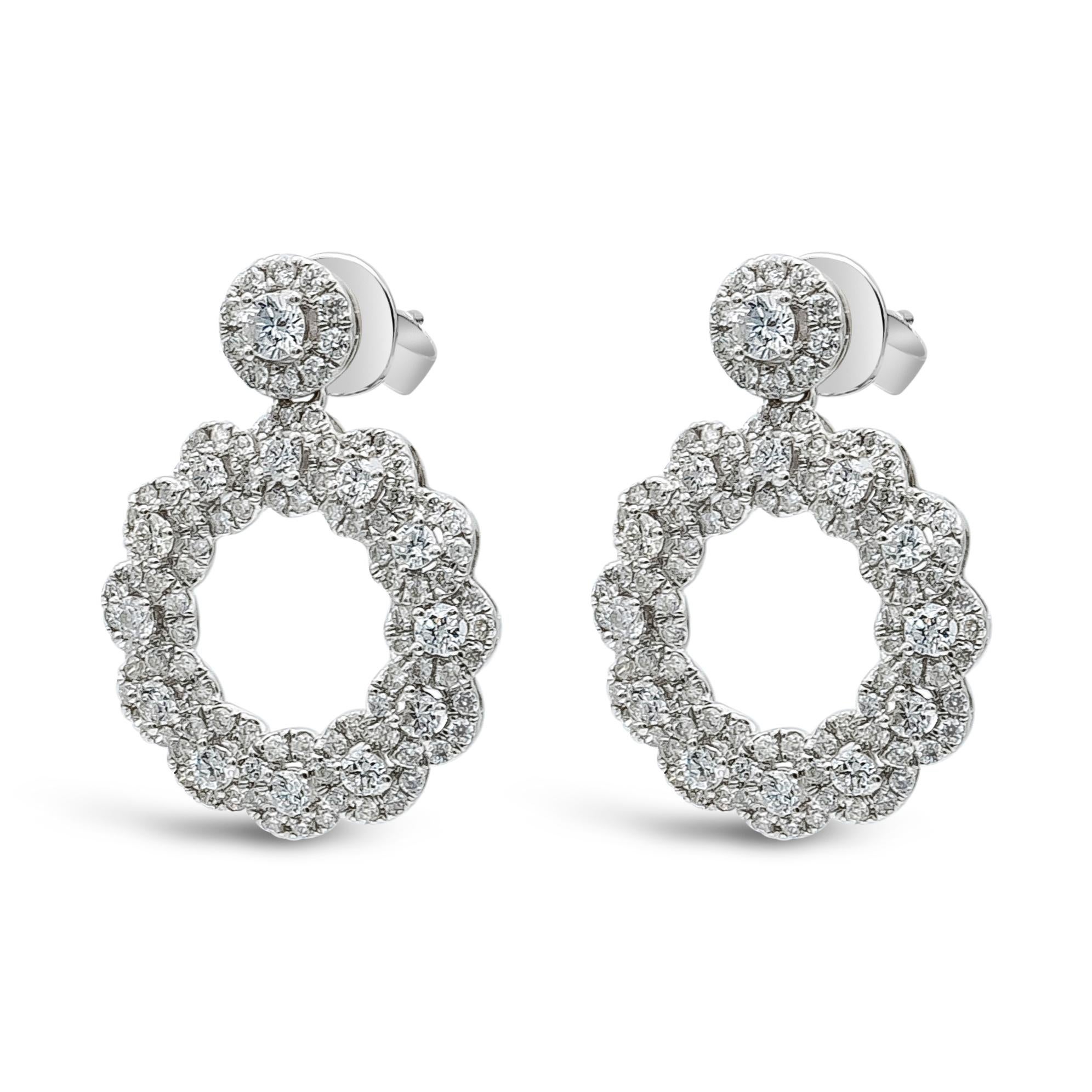 A classy and unique  dangle earrings showcasing 1.42 carat total, 214 pieces of brilliant round cut diamonds, F-G color and VS-SI in clarity. Set in a fashionable open-work circular design and finely made in 18k White Gold. 

Style available in