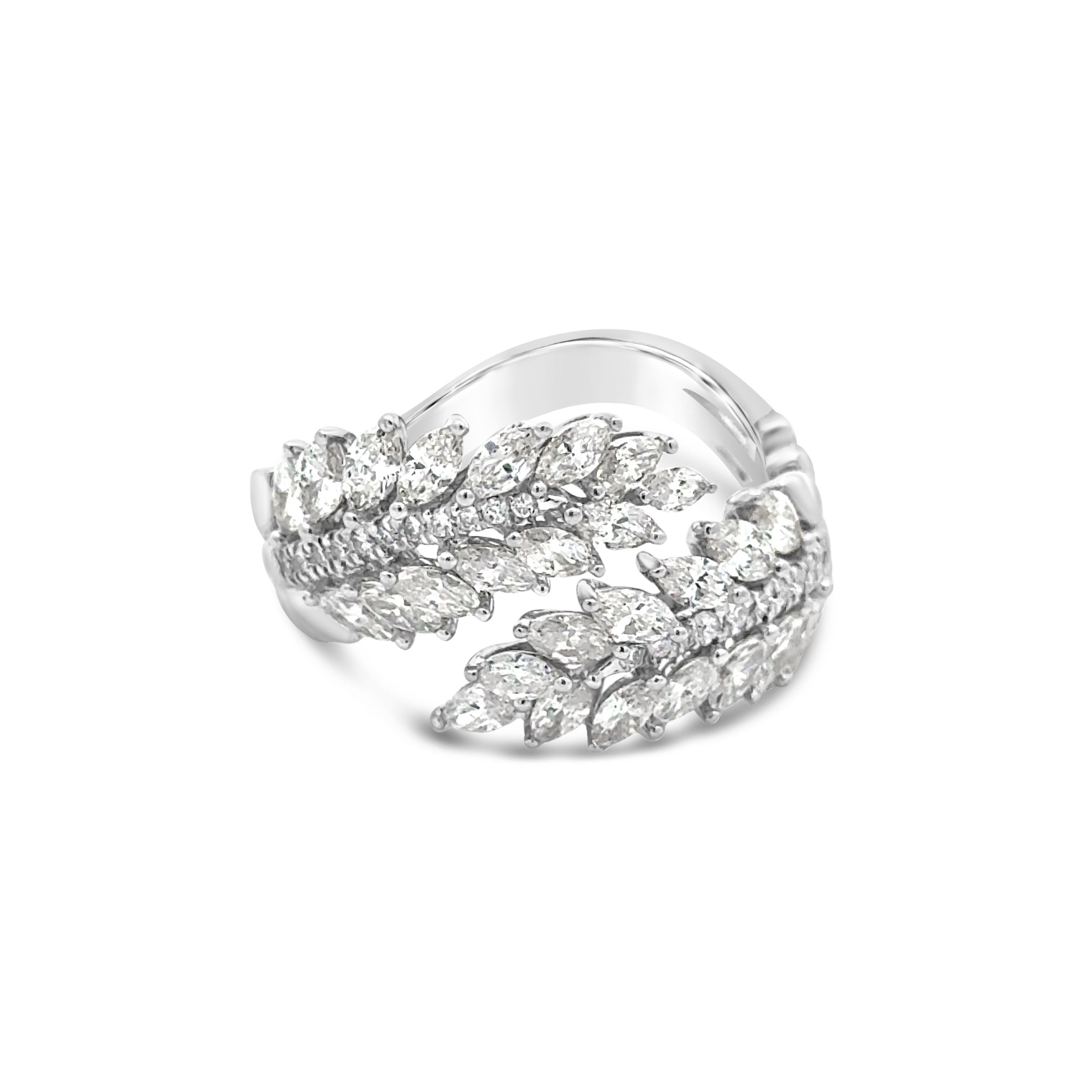 A well-crafted fashion ring, featuring two leaves made of marquise cut diamonds with round cut diamonds on the spine, set in a disconnected style. Diamonds weigh 1.42 carats total. Finely made with an 18K white gold mounting. Size 6.5 US, resizable