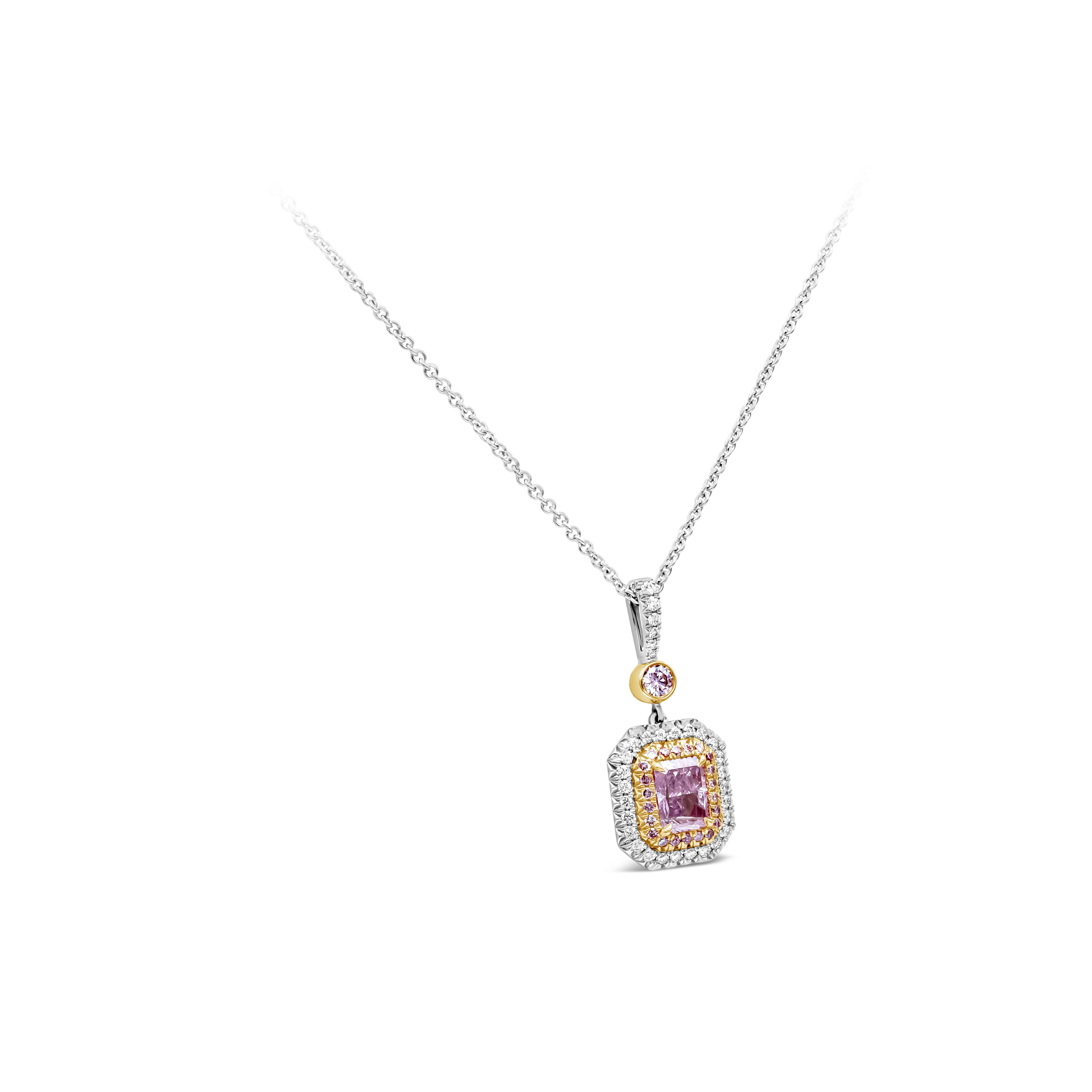 This beautiful pendant necklace showcasing a GIA Certified 1.01 carat radiant cut fancy purple pink diamond is surrounded by a double halo. The inner halo features 22 round pink diamonds weighing 0.11 carats. The outer halo features 32 brilliant
