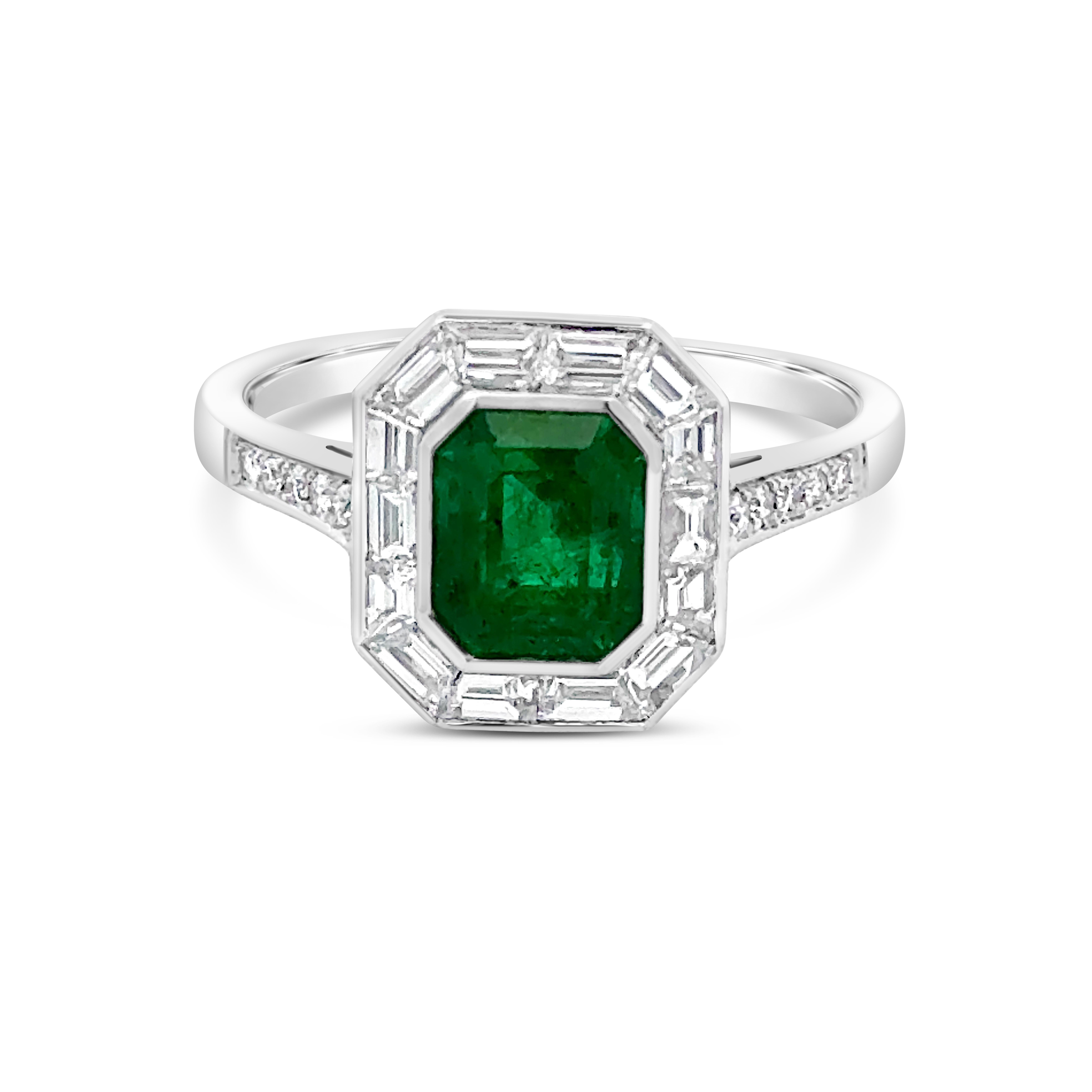 A precious engagement ring, featuring a 1.44 carats emerald cut Colombian emerald, bezel-set in platinum. Surrounded by channel-set tapered baguette cut diamonds and accented by round cut diamonds on the shank in a half-eternity setting. Accent