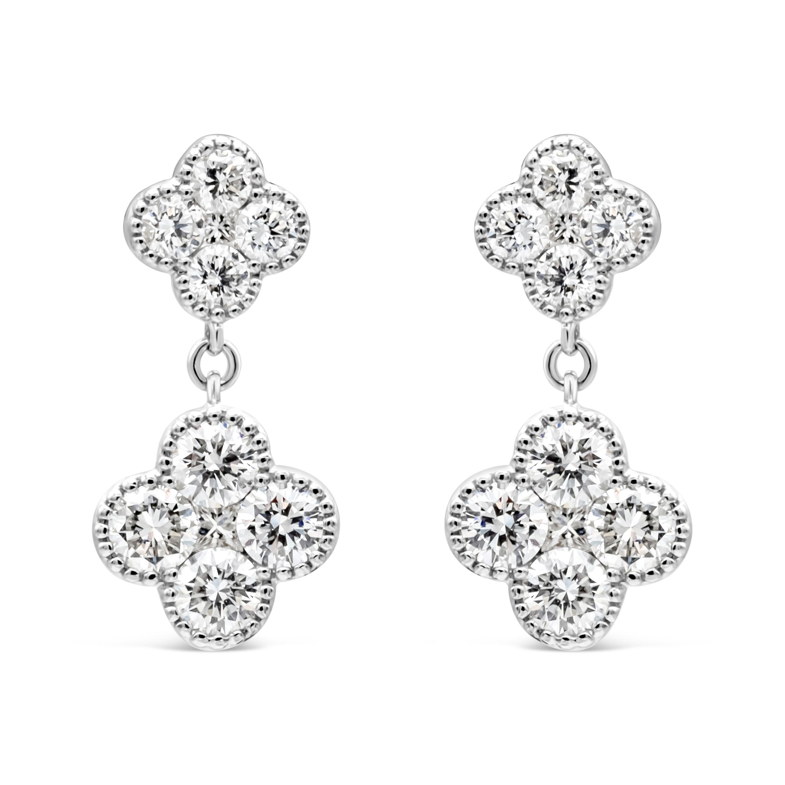 Elegant and chic classic drop earrings showcasing a two beautiful clover design round cut diamonds, suspended on an another brilliant round diamonds set in a clover design. Diamonds weigh 1.48 carats total, F color and VS in clarity. Finely made in