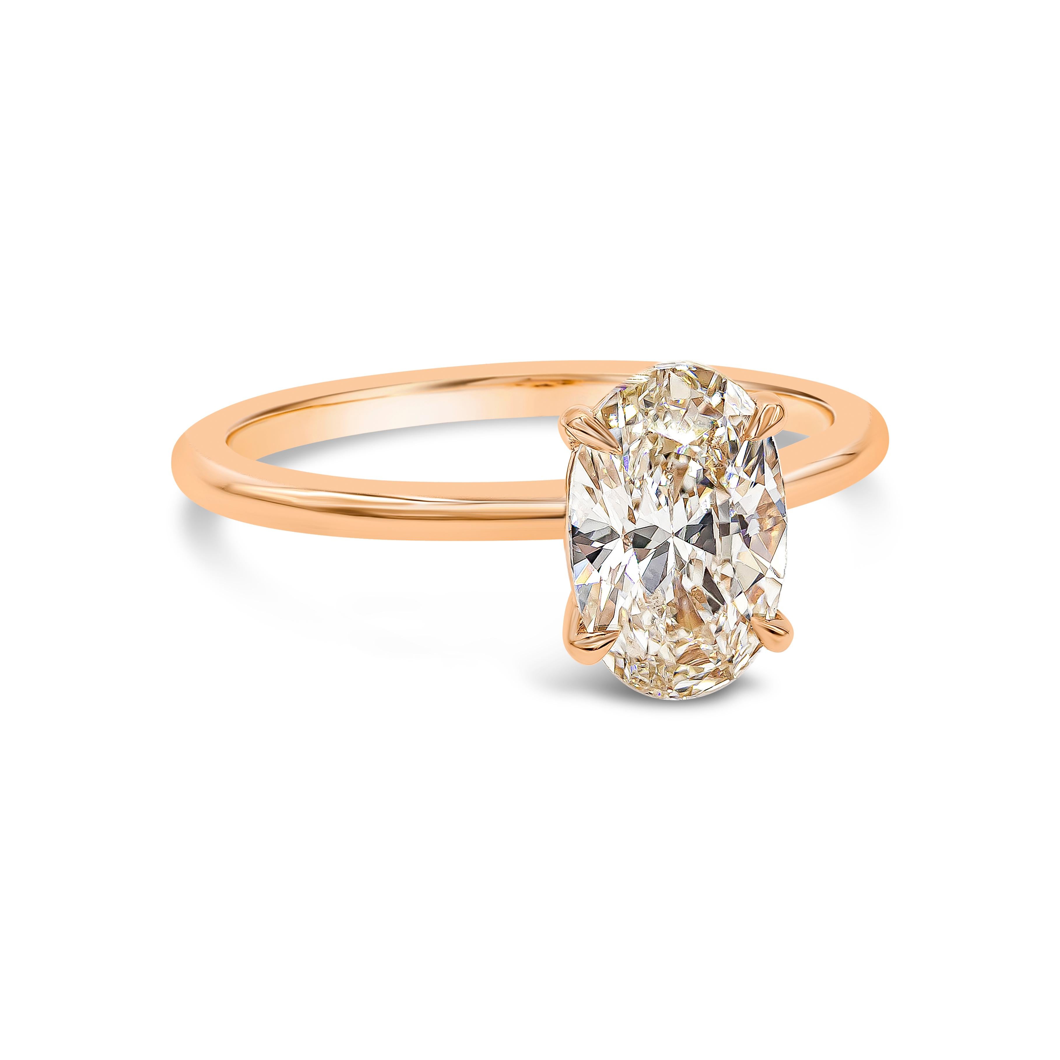 A classic engagement ring style showcasing a single 1.49 carat oval cut diamond, set in a traditional four-prong setting made in 18k rose gold. Size 6.5 US.

Style available in different price ranges. Prices are based on your selection. Please